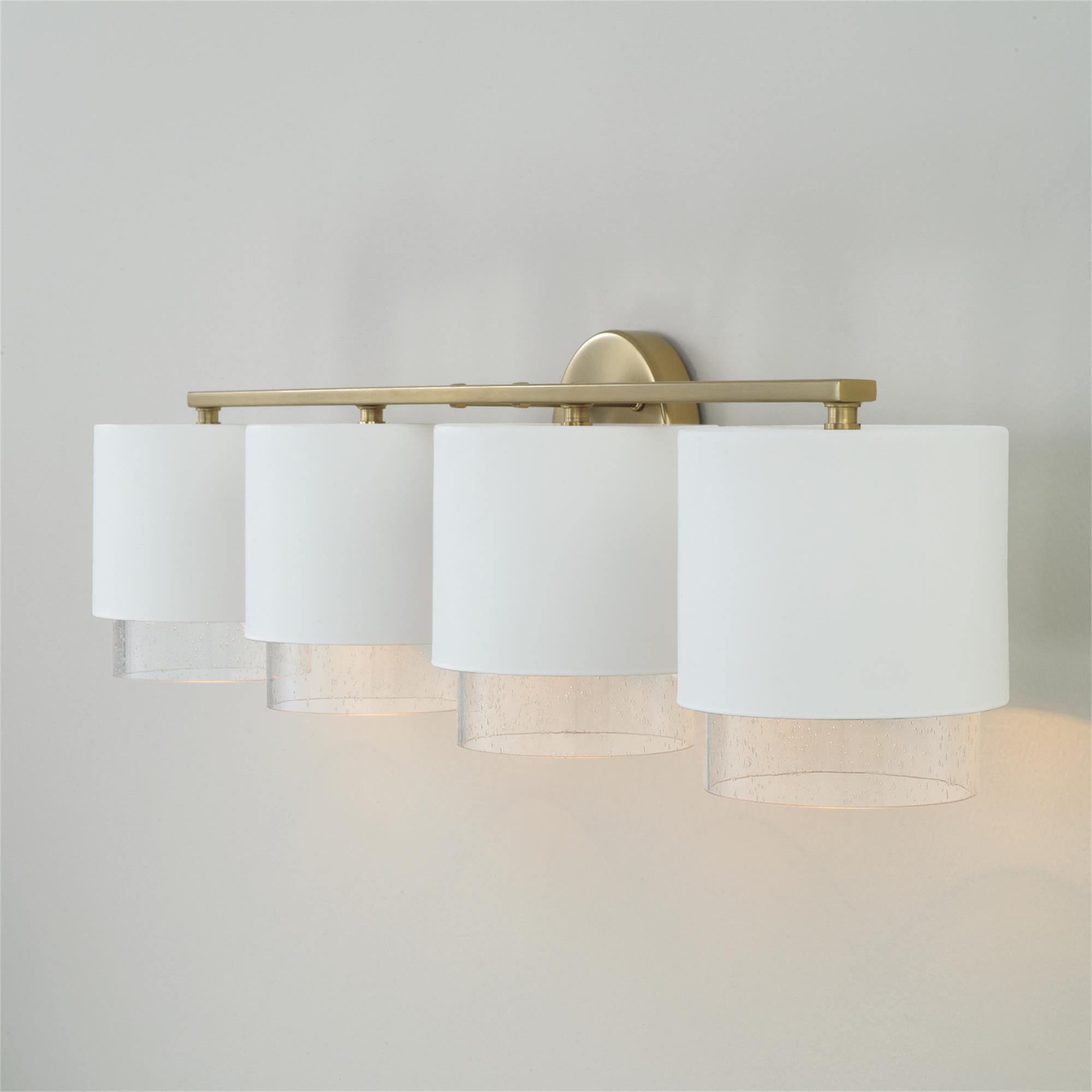 Shown in Matte Brass and White finish and Clear Seeded glass and Metal with Brass Interior shade