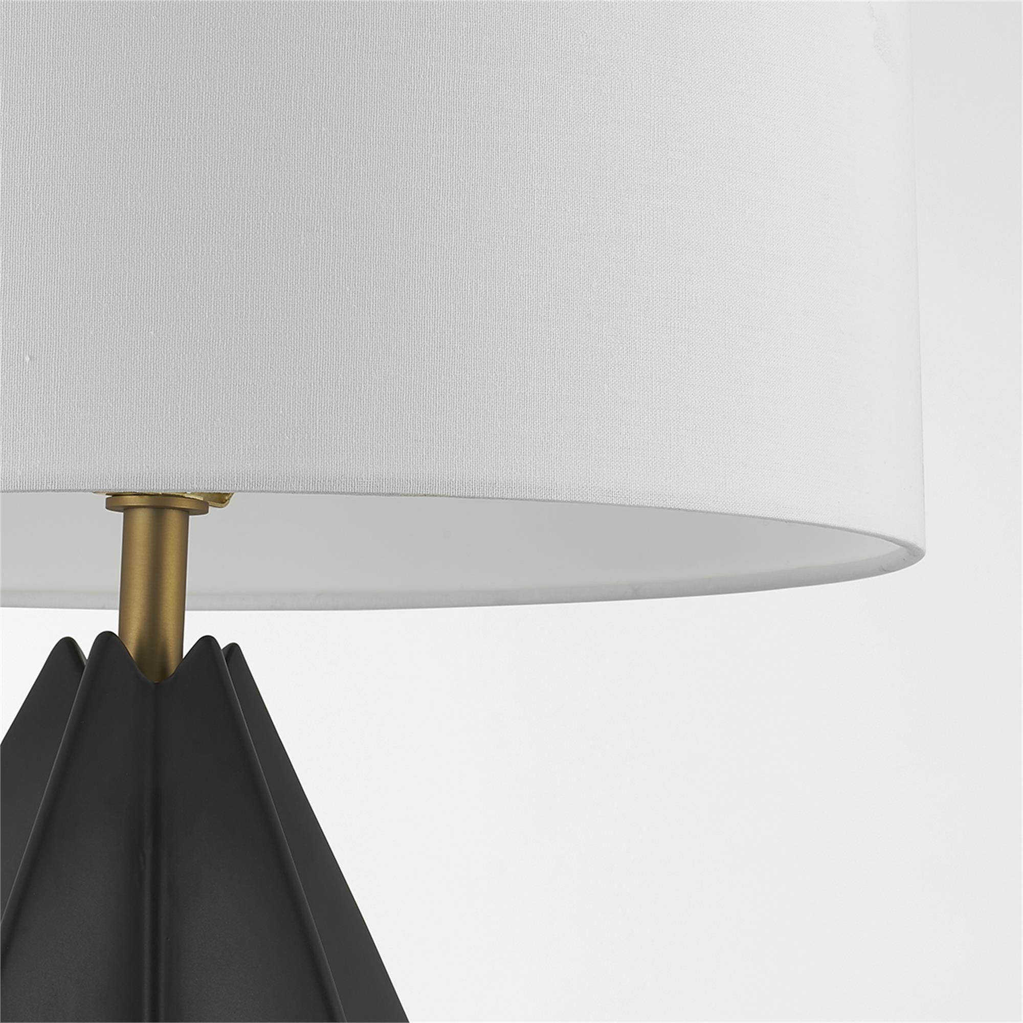 Shown in Patina Brass finish and White Linen shade