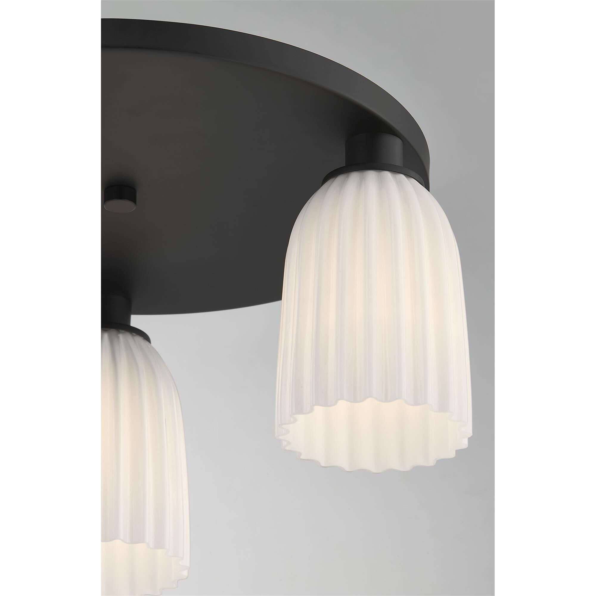 Shown in Matte Black finish and White Opal Ribbed glass