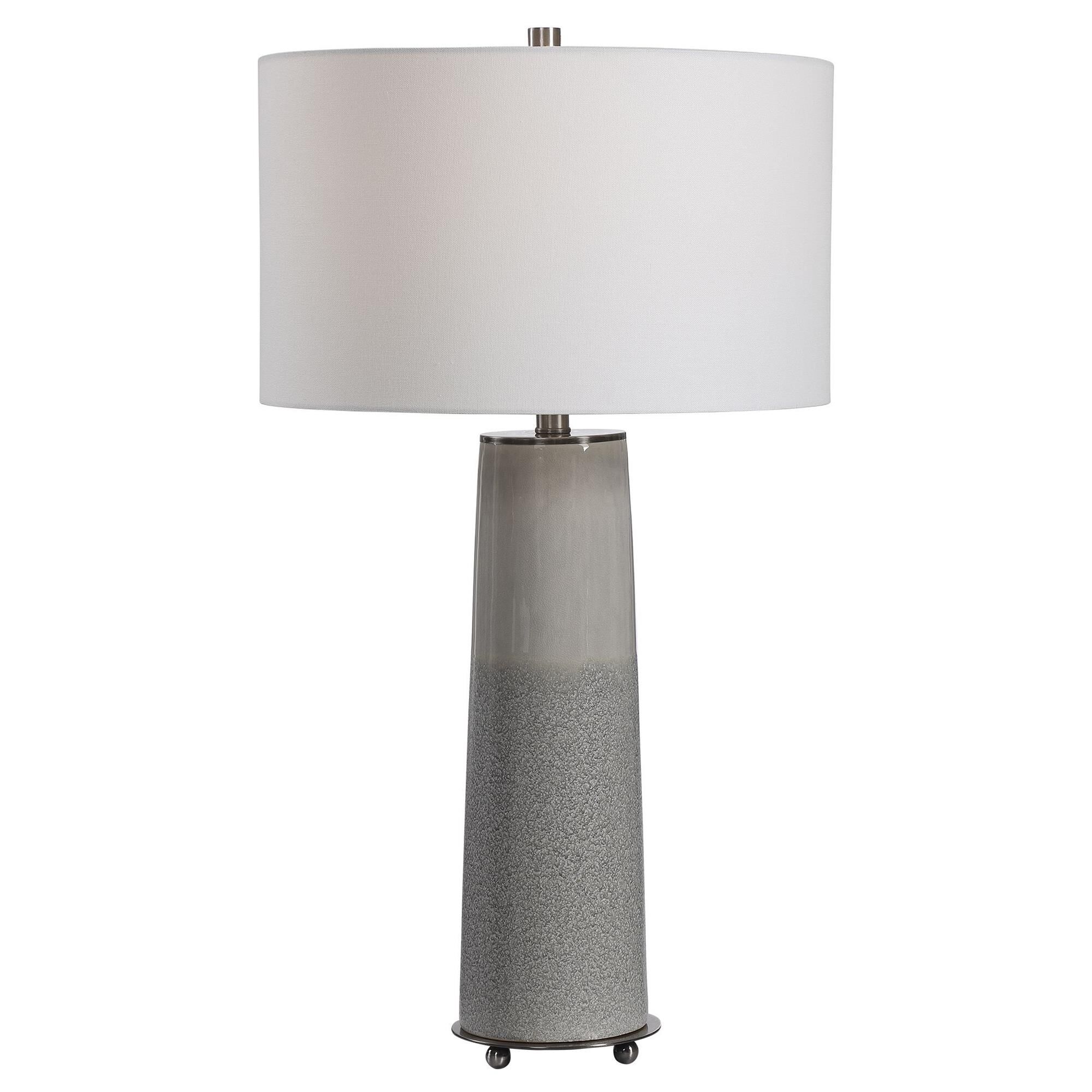 Shown in Sleek And Contemporary, This Ceramic Table Lamp Showcases A Two Tone Light Gray Glaze With A Gloss S finish and Round Drum Hardback shade