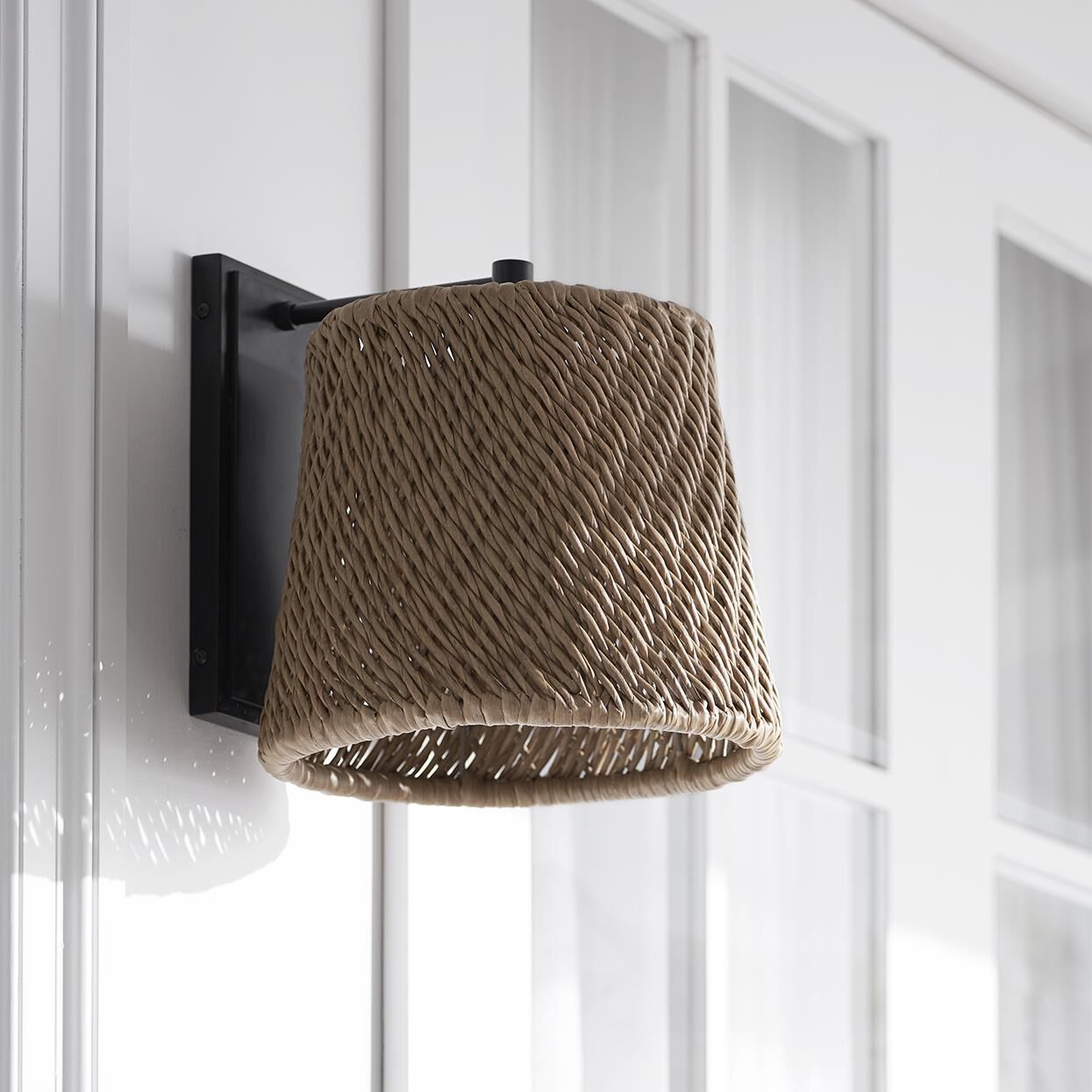 Shown in Charcoal finish and All Weather Wicker Seagrass shade