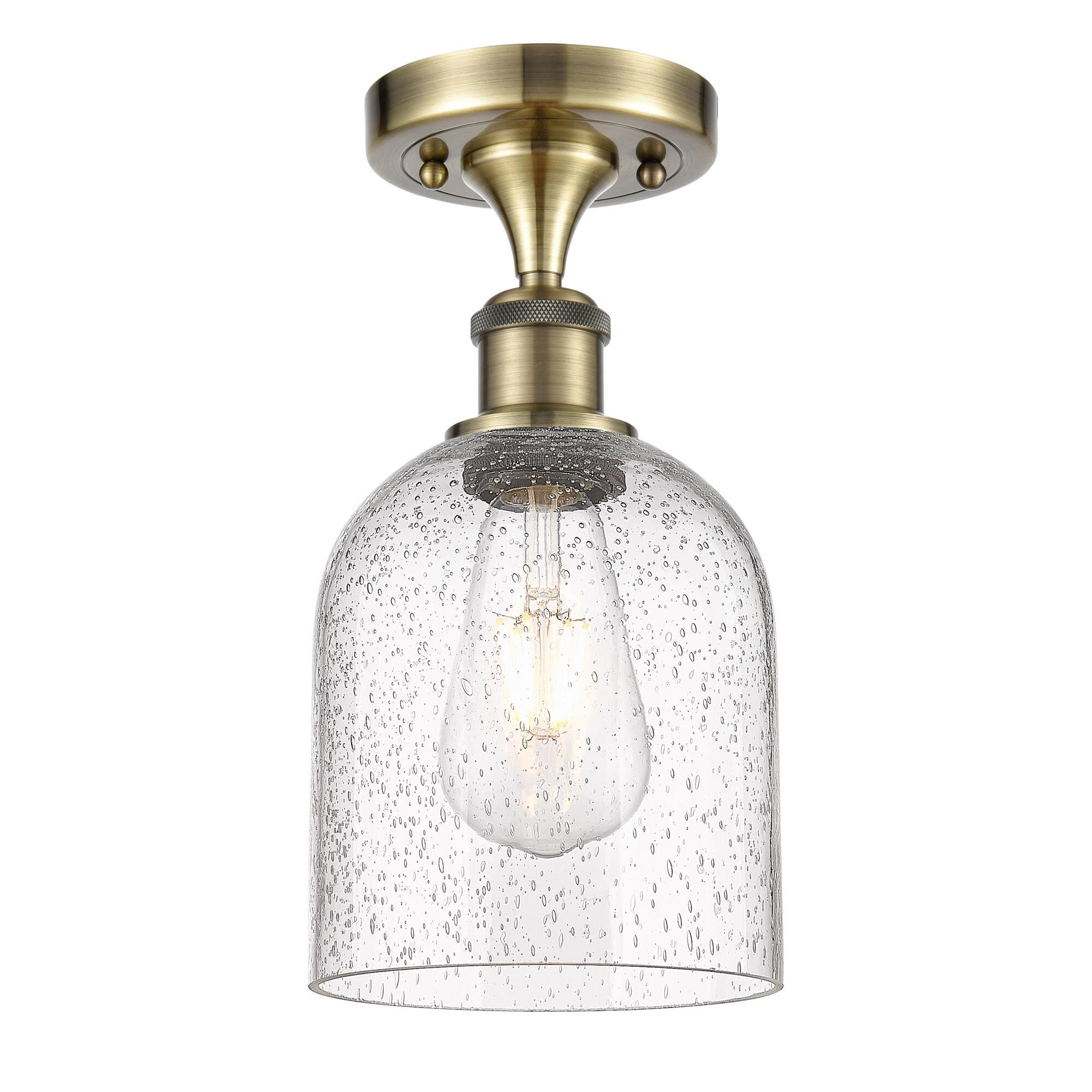 Shown in Antique Brass finish and Seedy glass