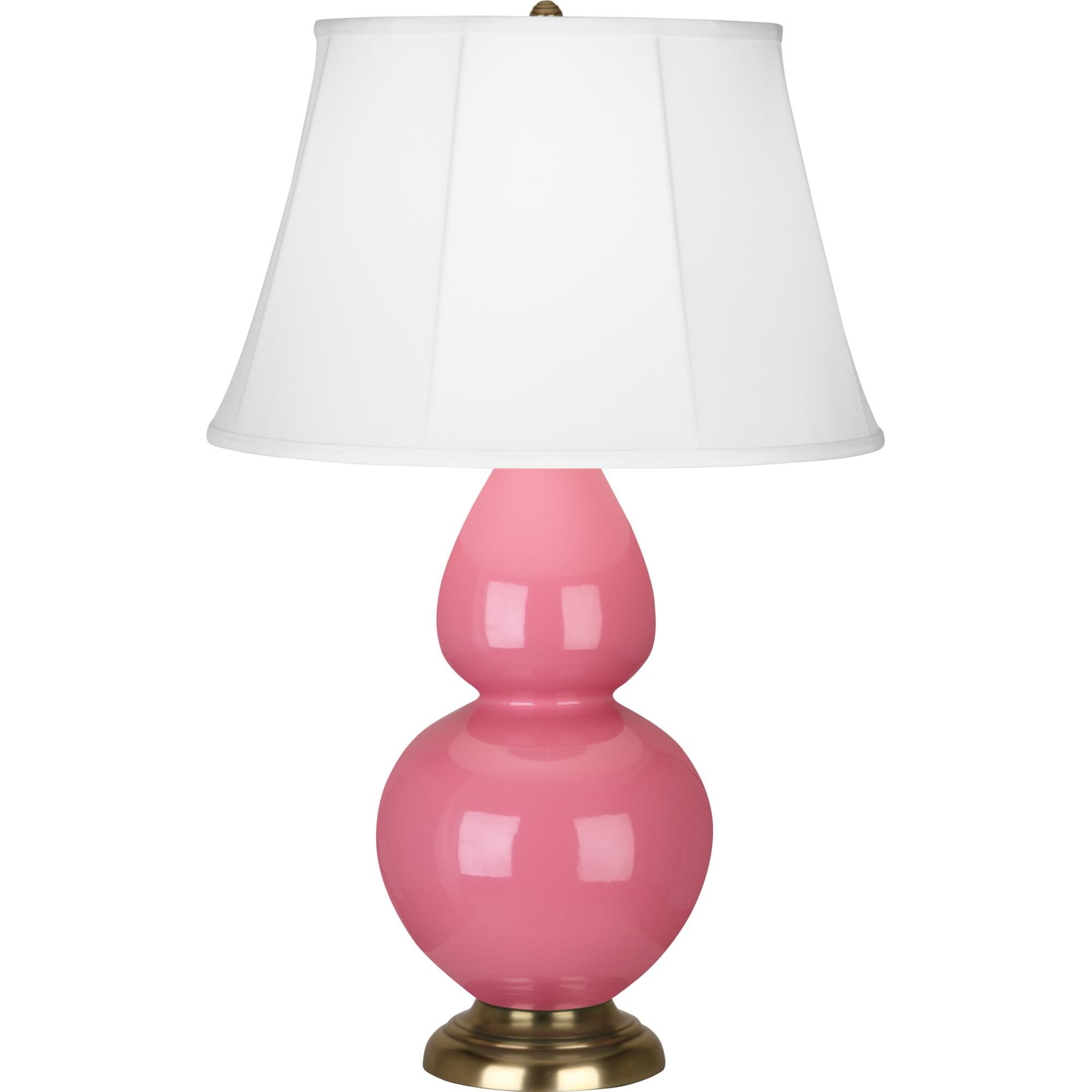 Shown in Schiaparelli Pink Glazed Ceramic With Antique Natural Brass ed Accents finish and Ivory Silk Stretched Fabric shade