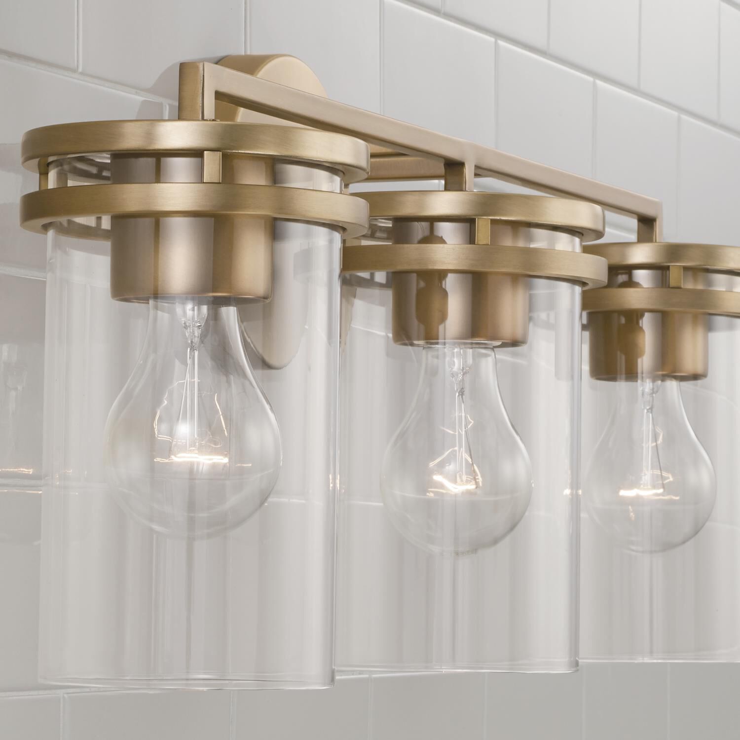 Shown in Aged Brass finish and Clear glass