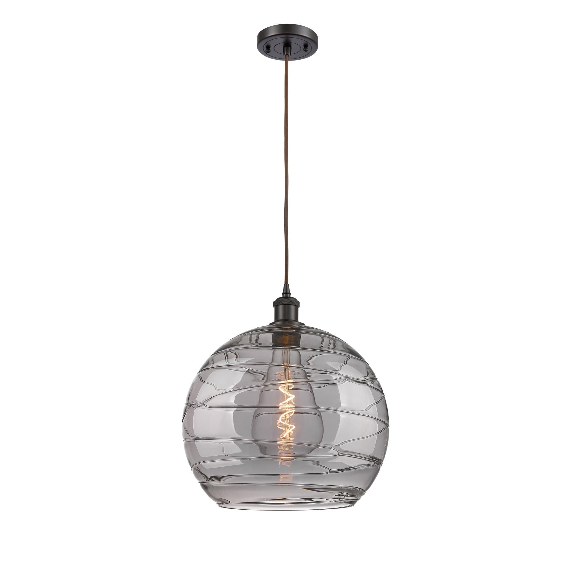 Shown in Oil Rubbed Bronze finish and Light Smoke Deco Swirl glass