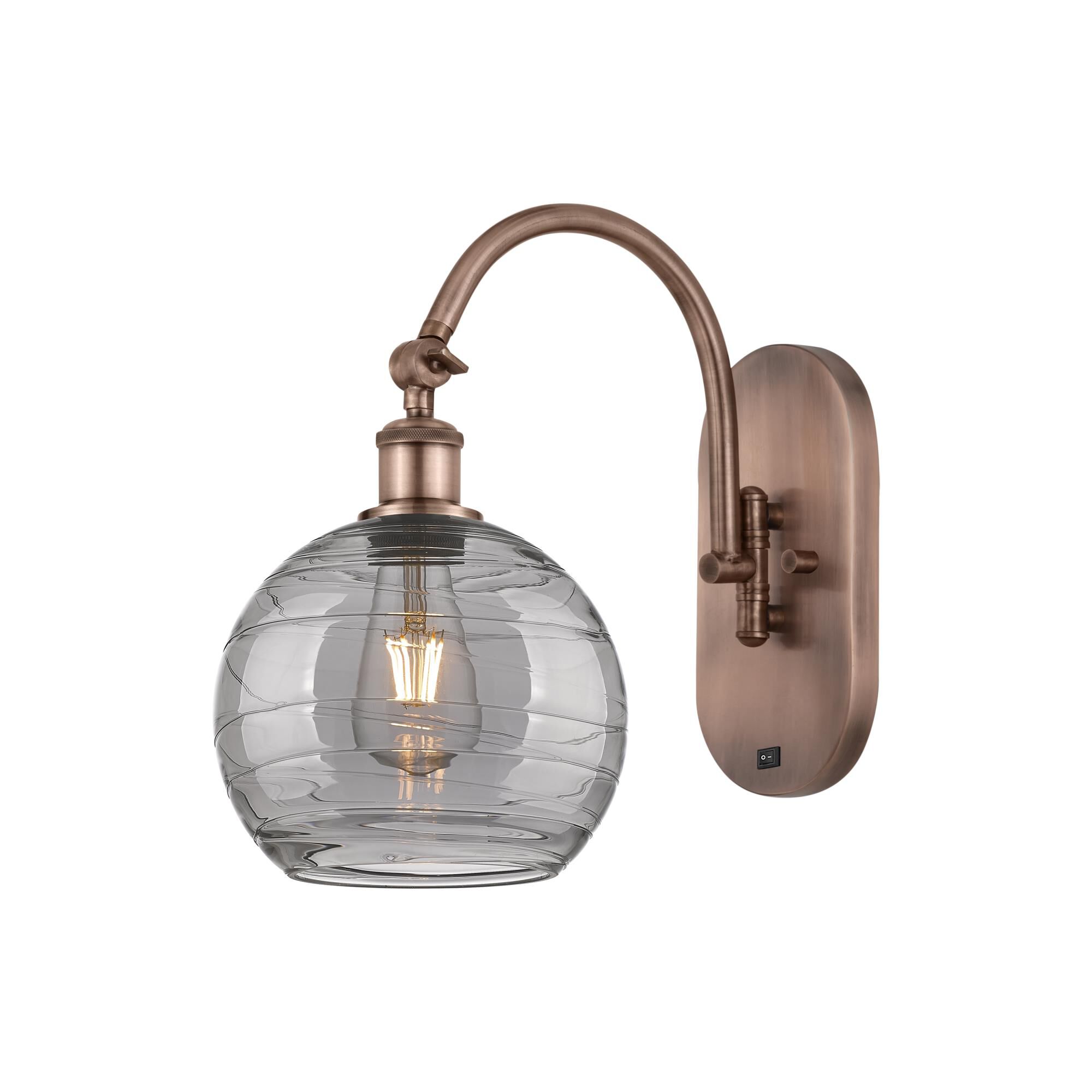 Shown in Antique Copper finish and Light Smoke Deco Swirl glass
