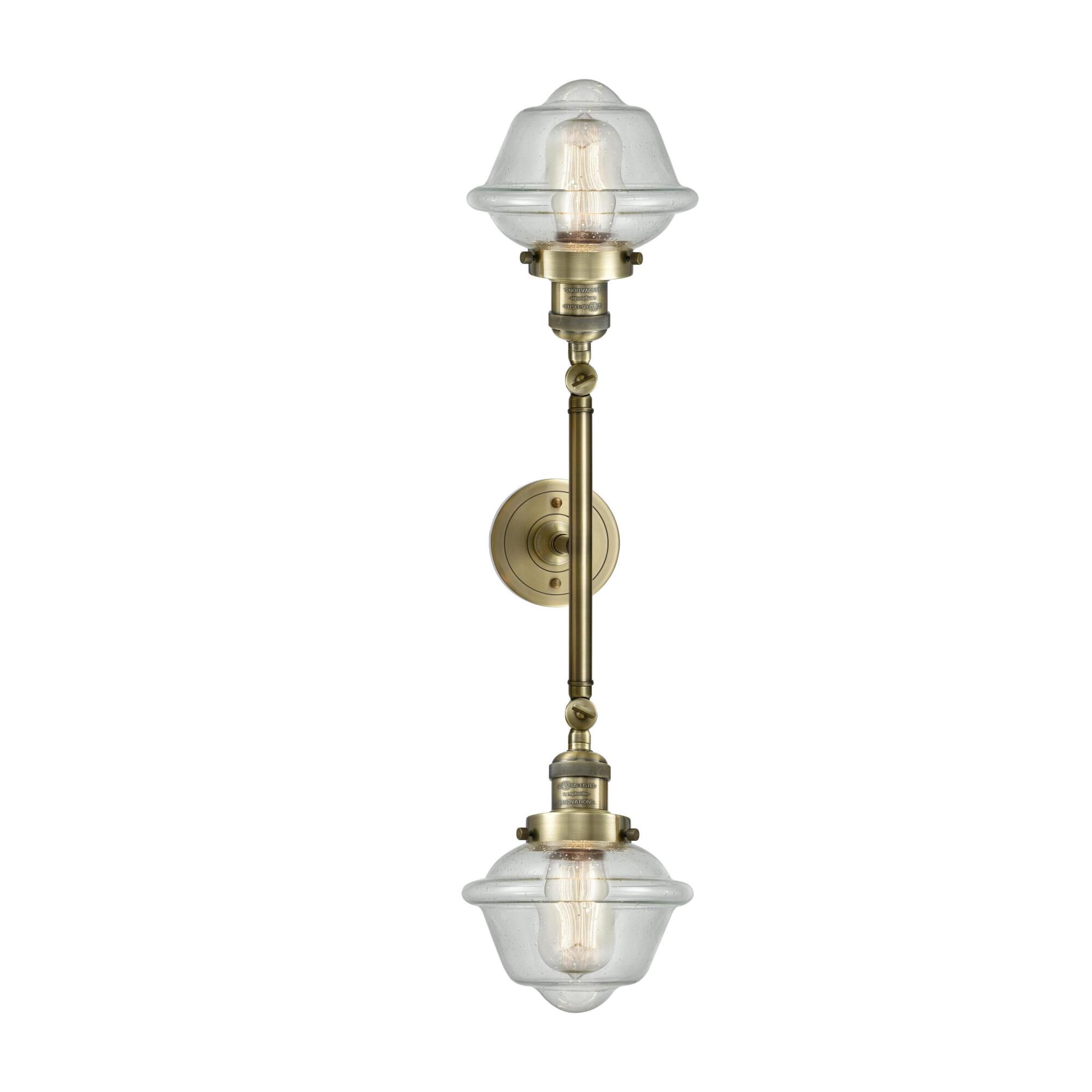 Shown in Antique Brass finish and Seedy glass