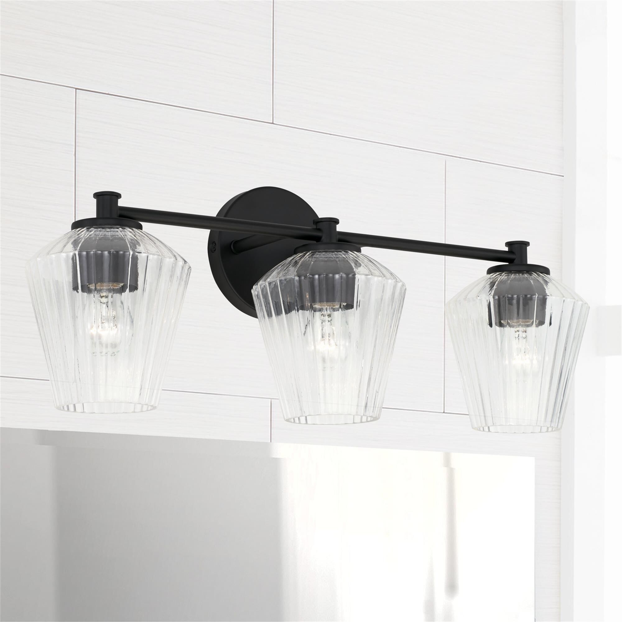Shown in Matte Black finish and Clear Fluted glass