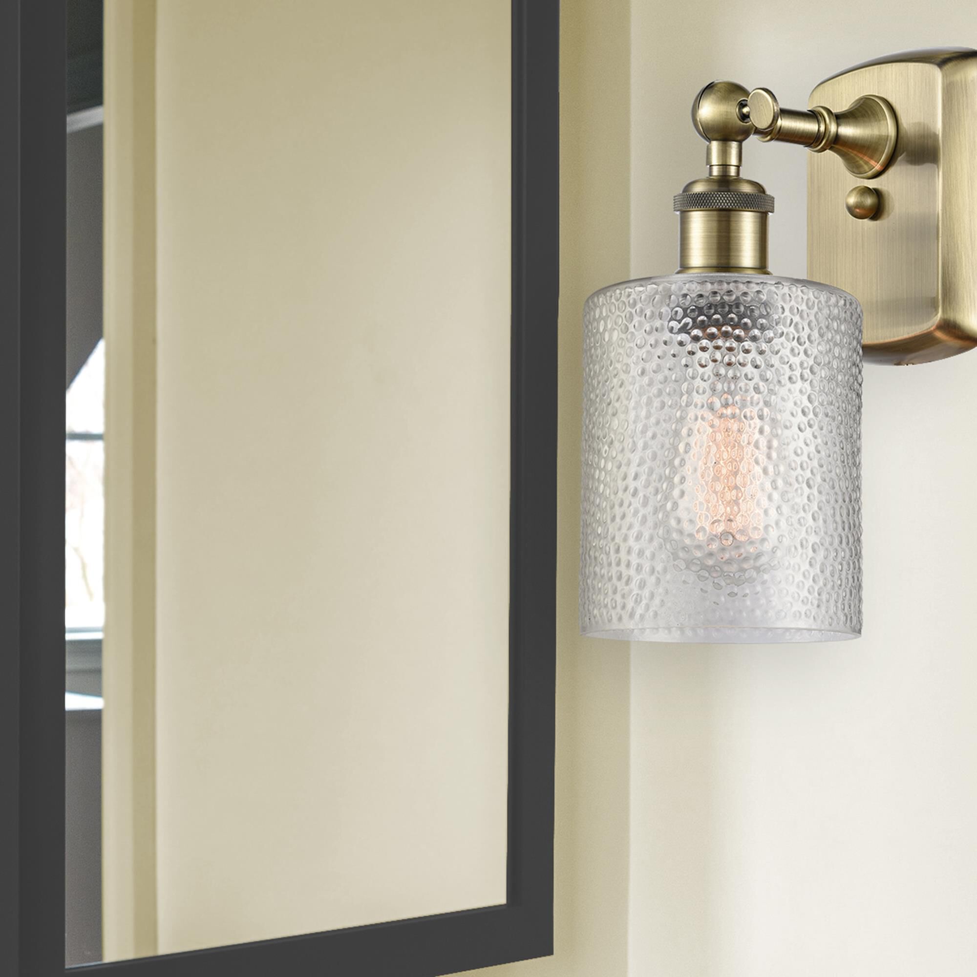 Shown in Antique Brass finish and Clear Cobbleskill glass and None shade