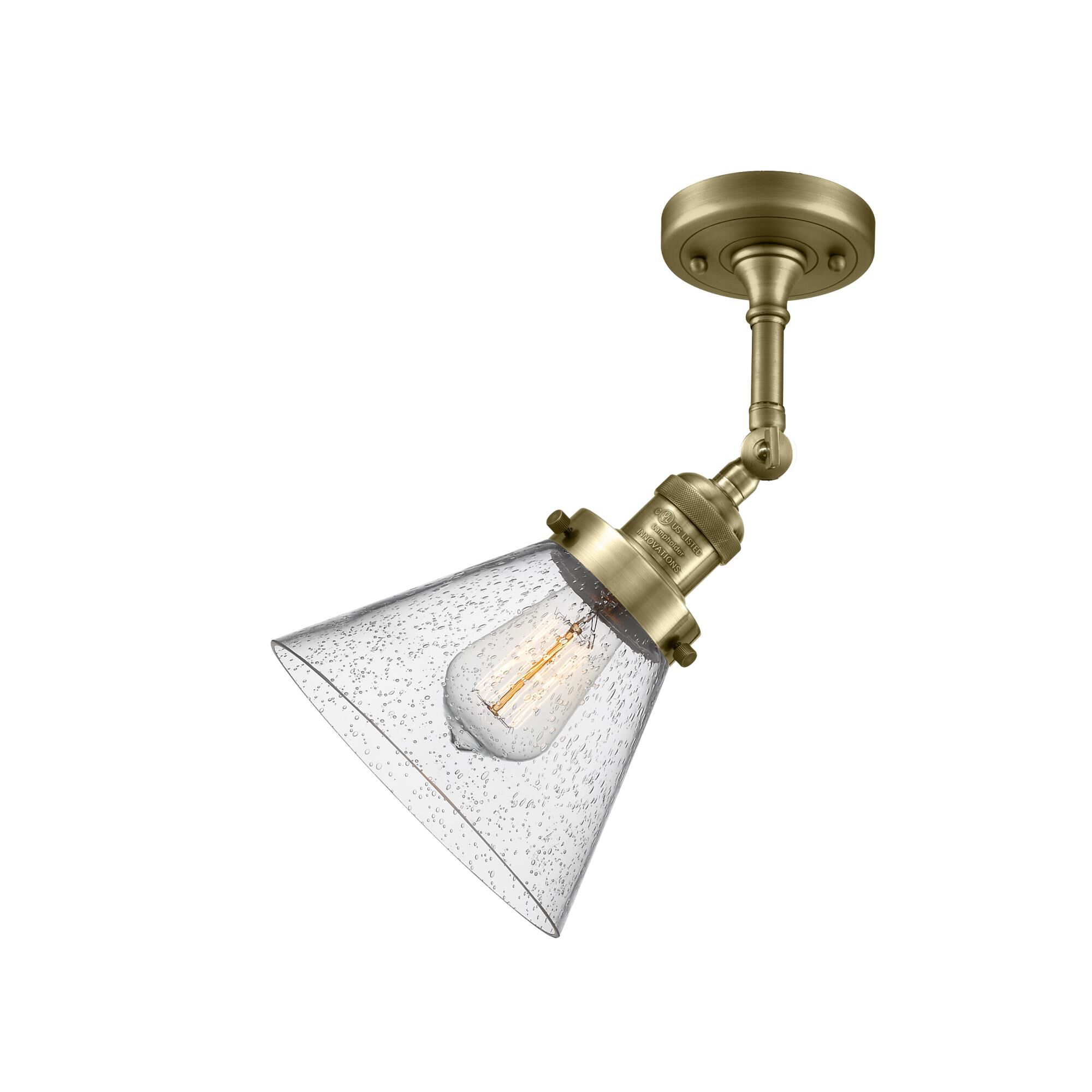 Shown in Antique Brass finish and Seedy glass