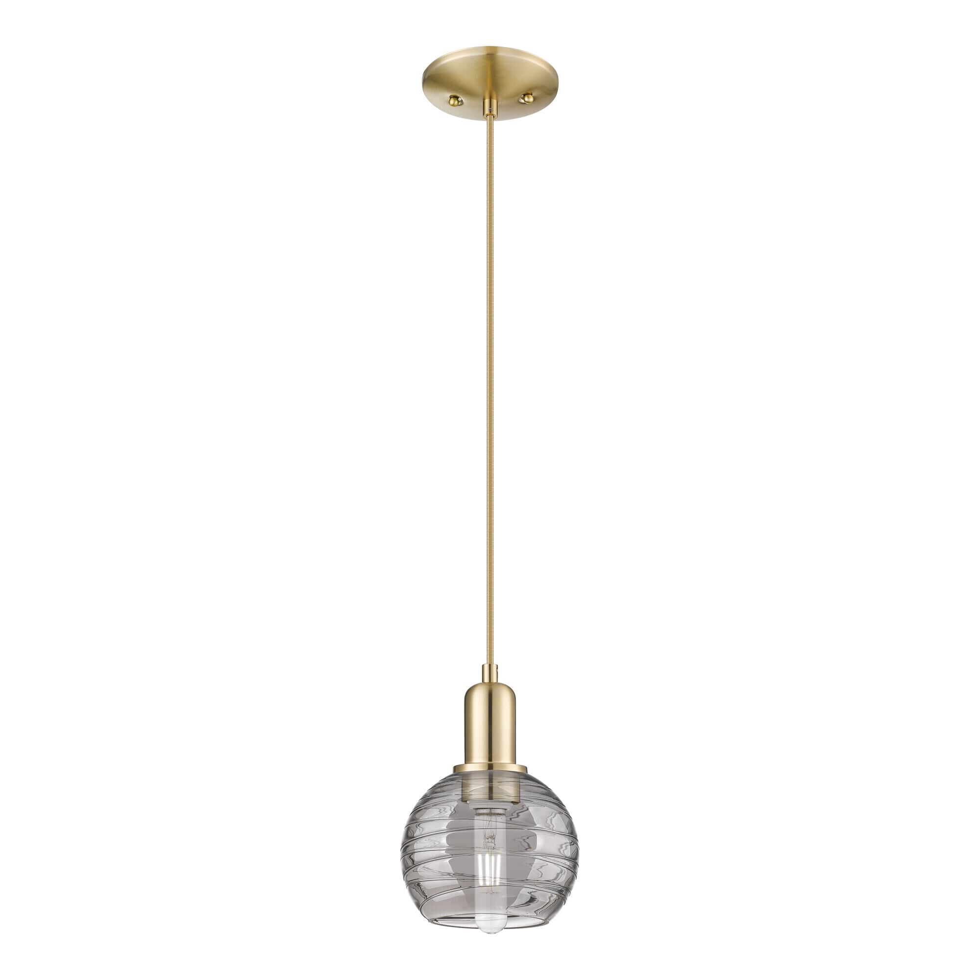 Shown in Champagne Bronze finish and Light Smoke Deco Swirl glass