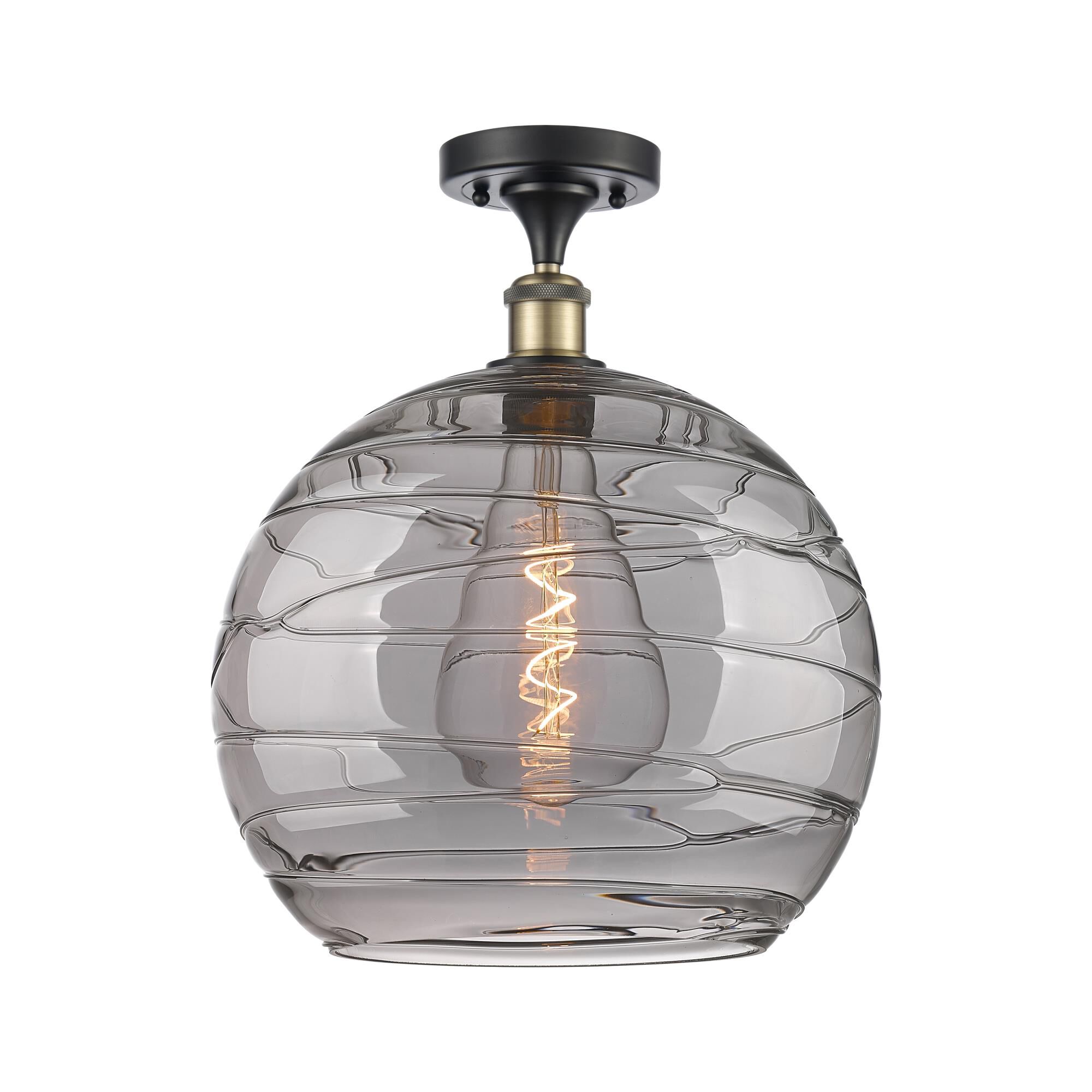 Shown in Black Antique Brass finish and Light Smoke Deco Swirl glass