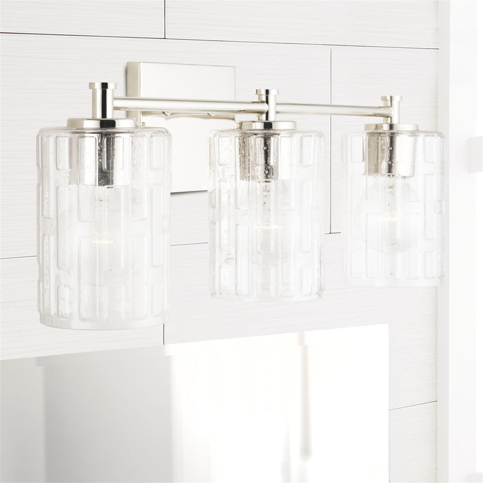 Shown in Polished Nickel finish and Clear Embossed glass