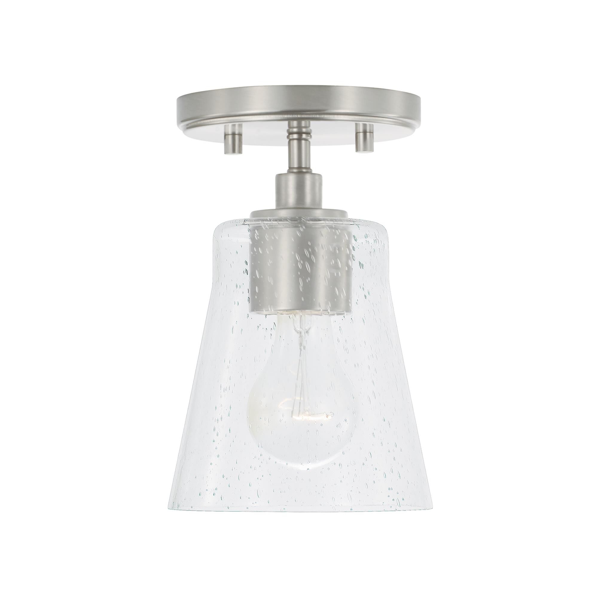 Shown in Brushed Nickel finish and Clear Seeded glass