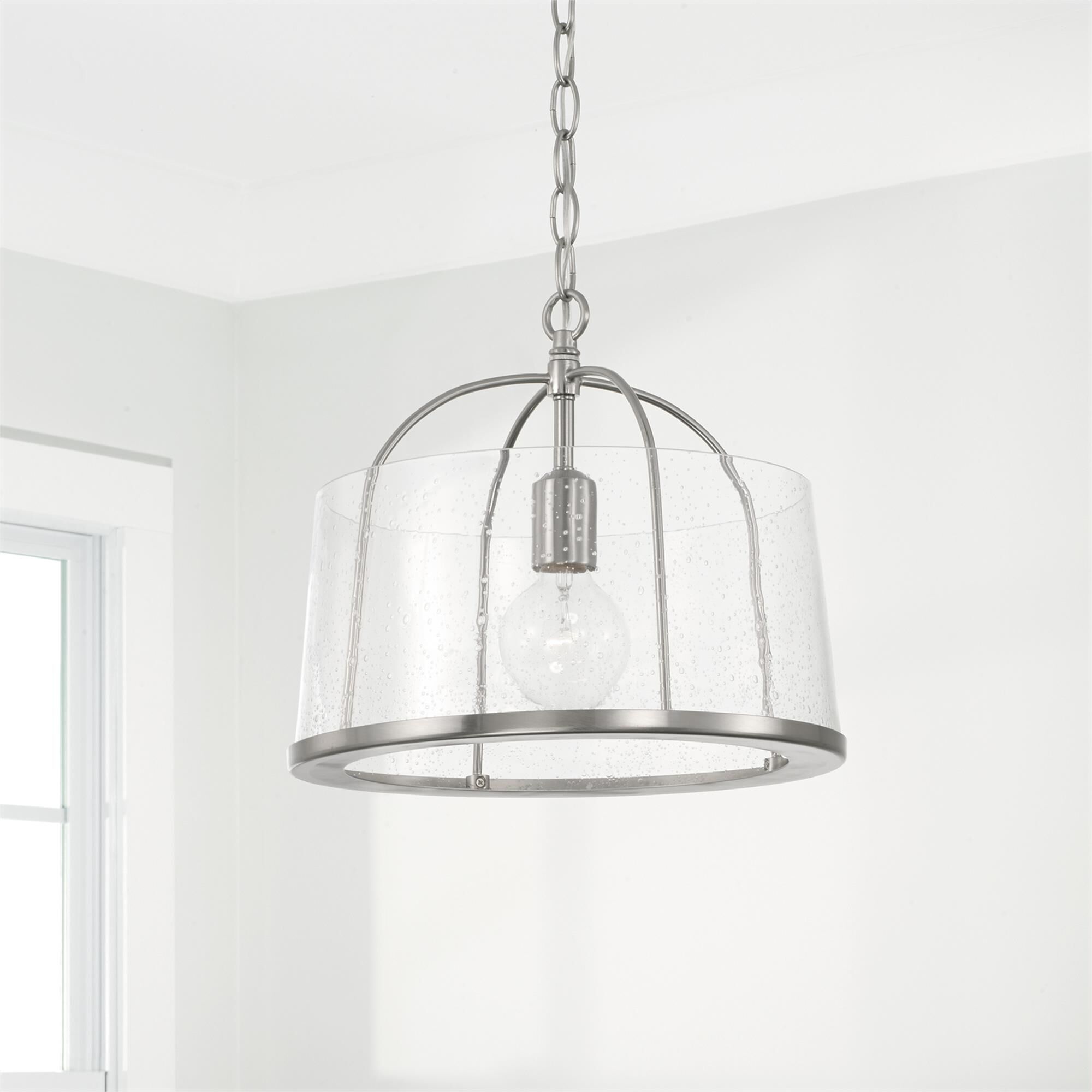 Shown in Brushed Nickel finish and Clear Seeded glass