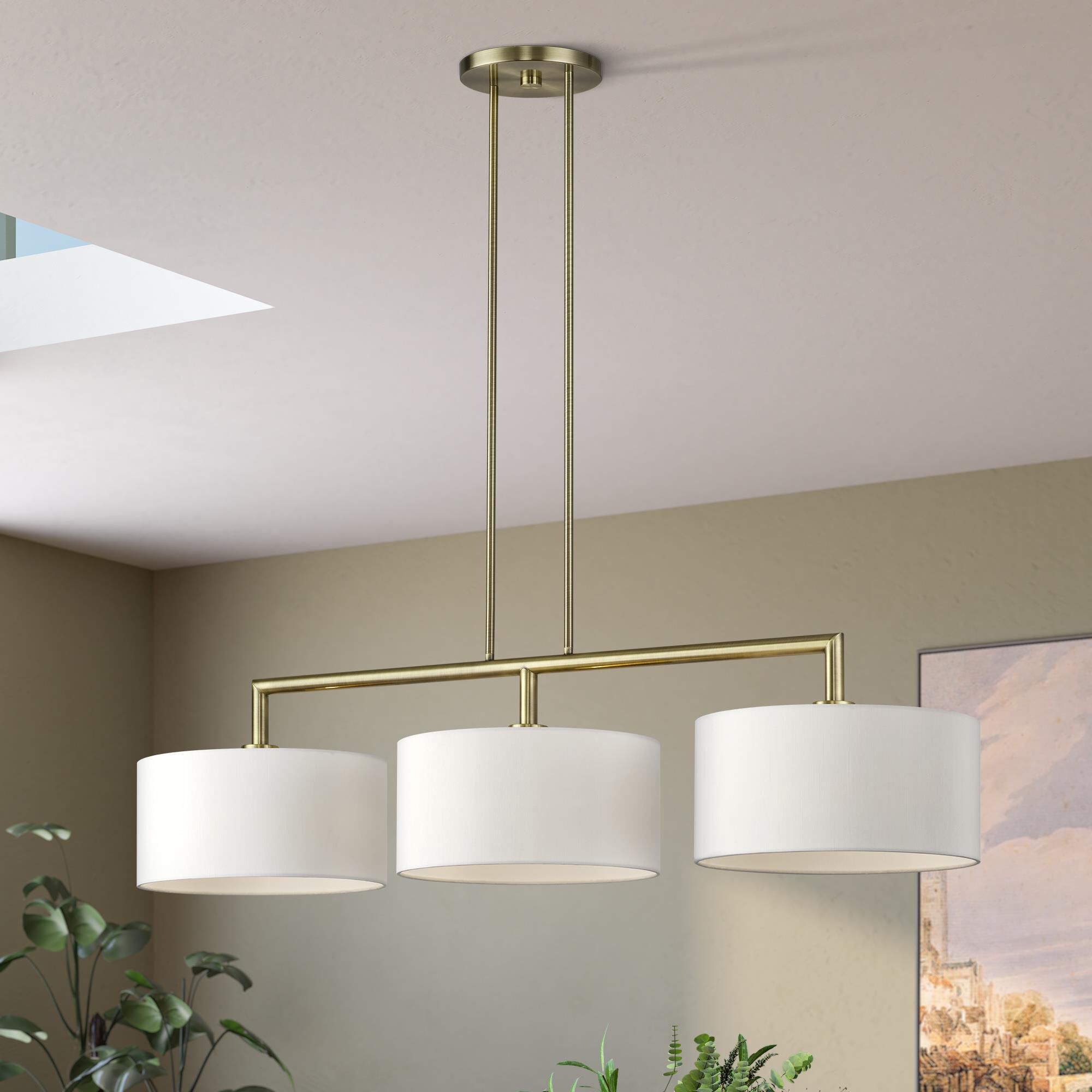 Shown in Antique Brass finish and Hand Crafted Off-White Fabric shade