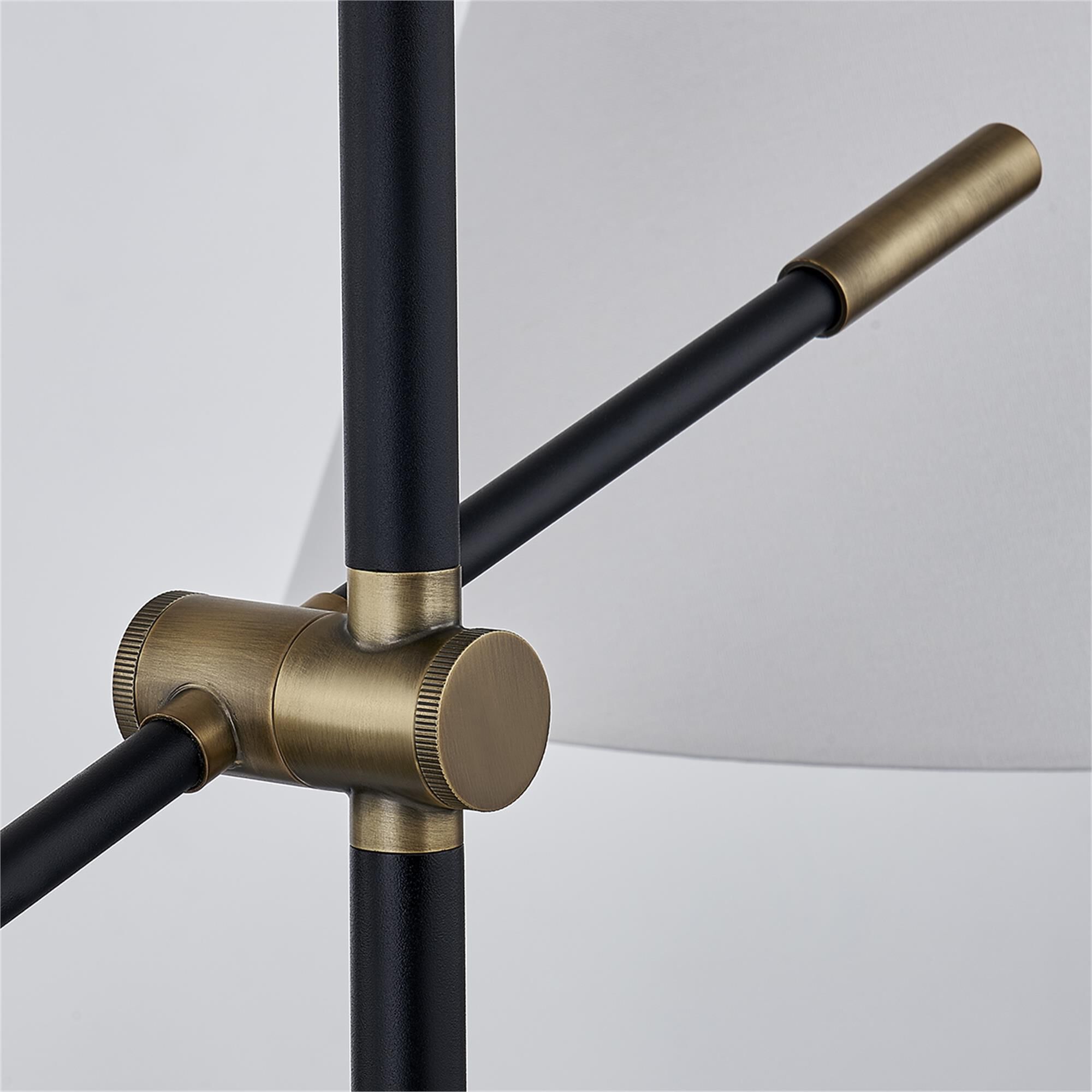 Shown in Patina Brass finish and White shade