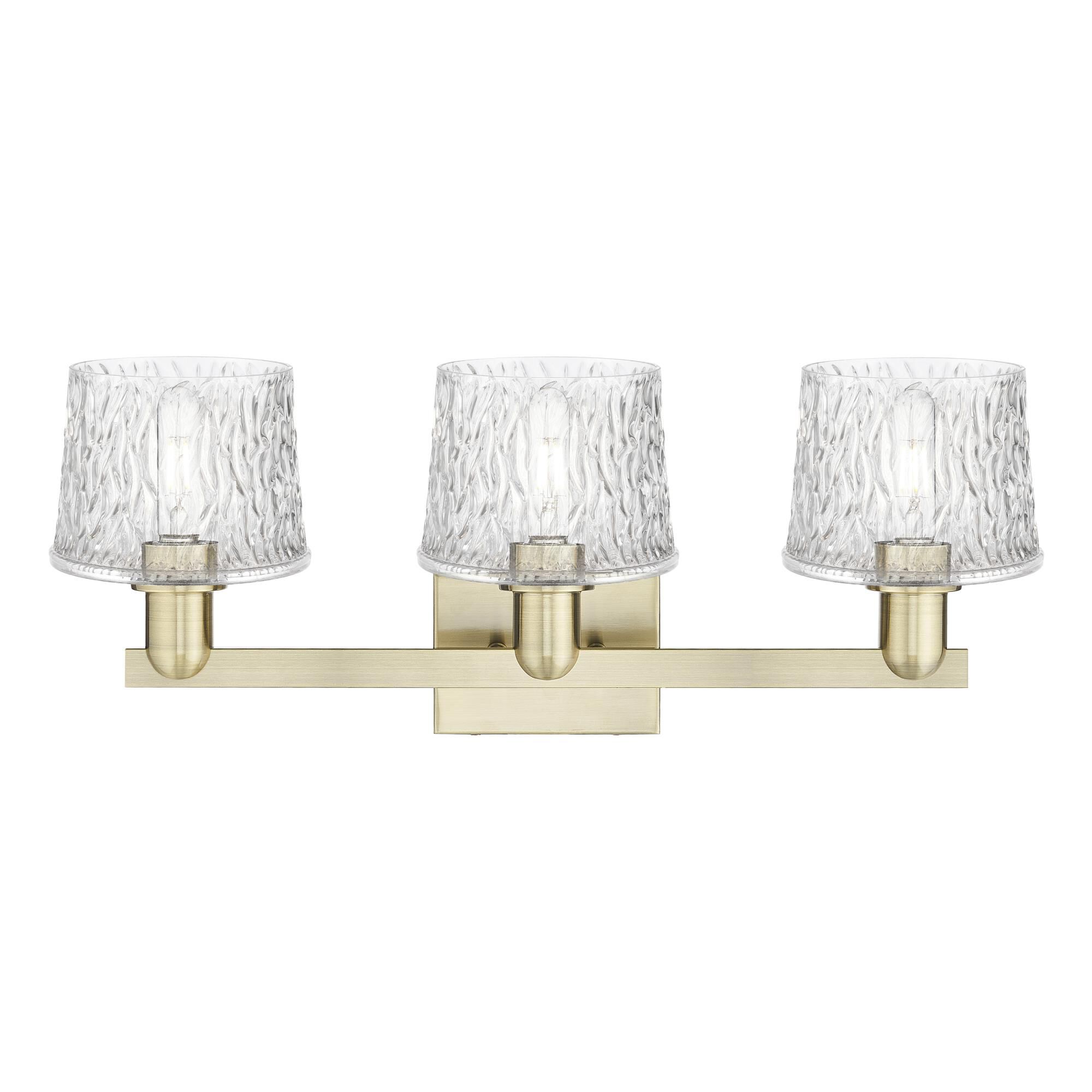 Shown in Antique Brass finish and Clear glass