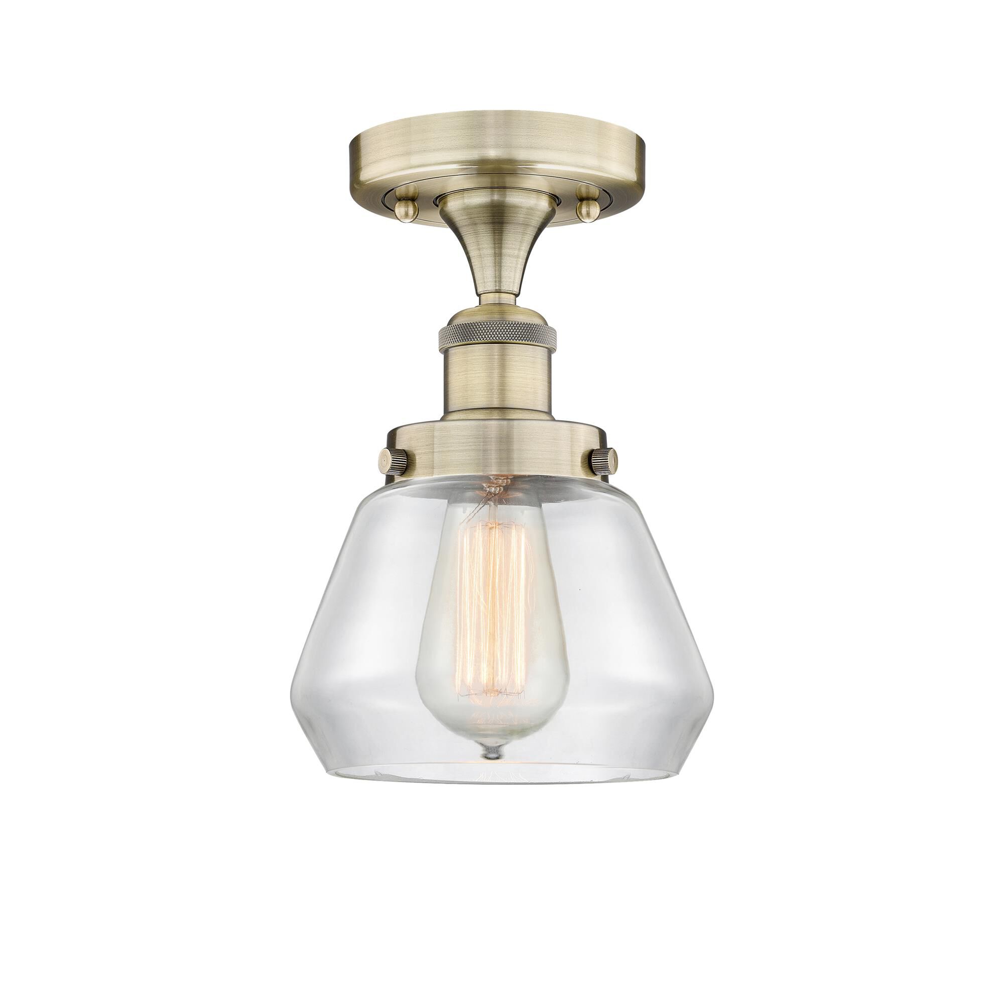 Shown in Antique Brass finish and Clear glass