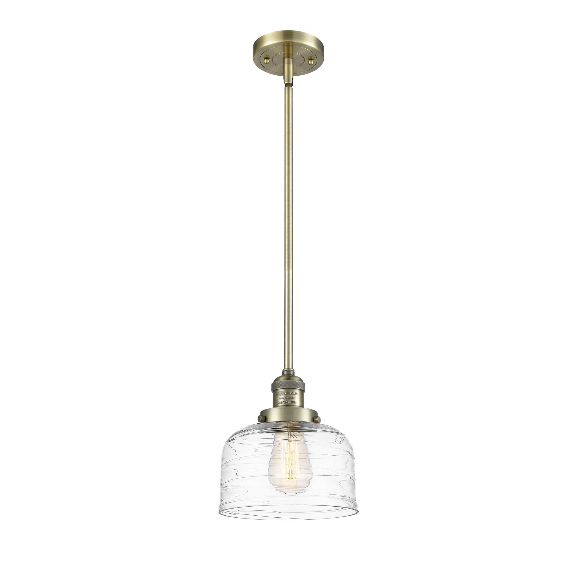 Shown in Antique Brass finish and Deco Swirl glass