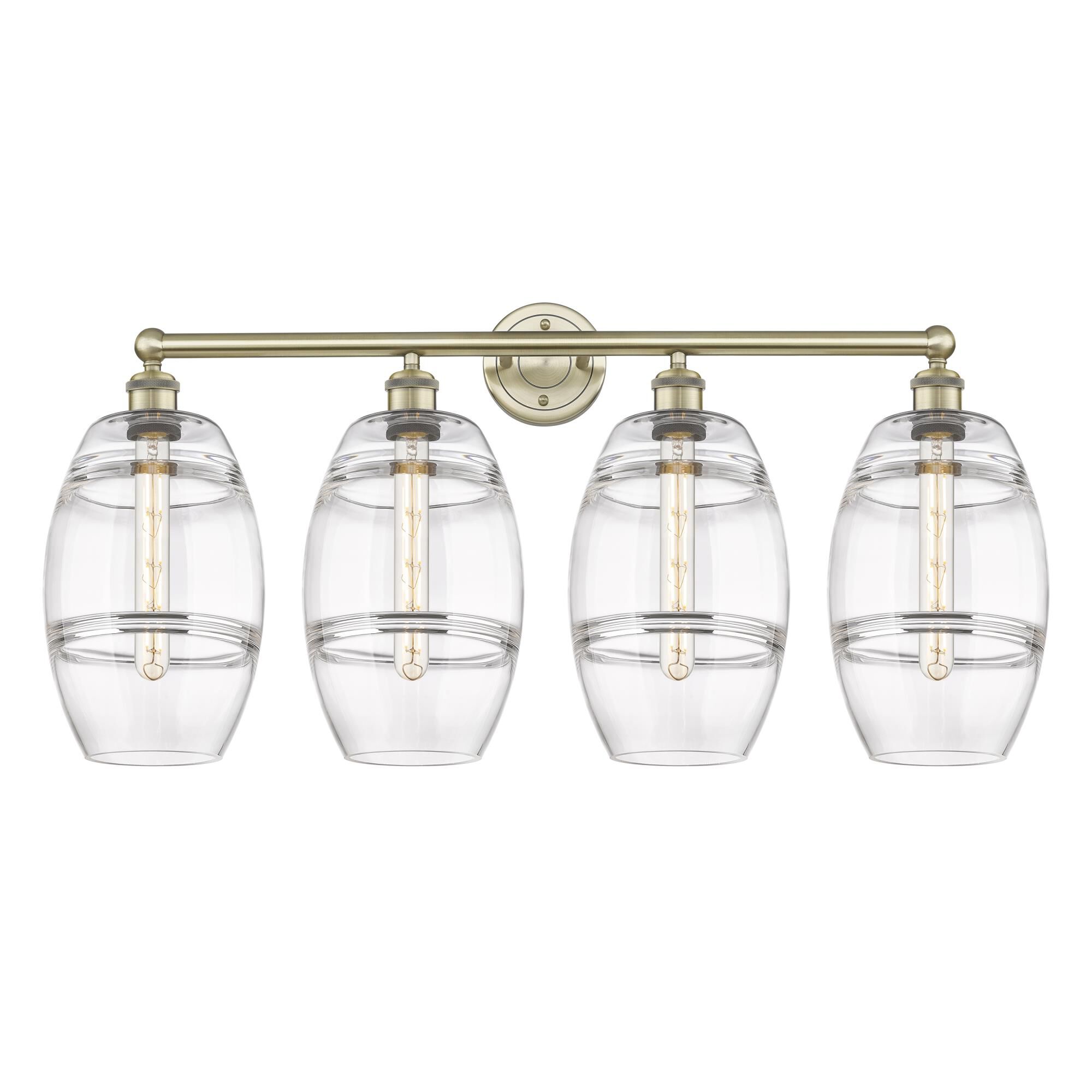 Shown in Antique Brass finish and Clear glass