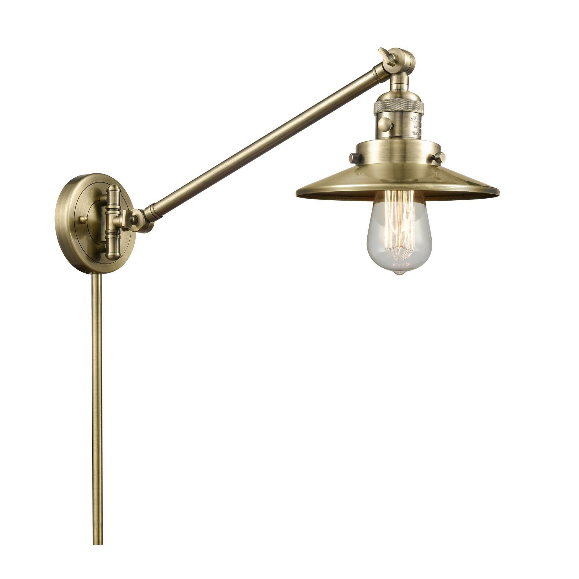 Shown in Antique Brass finish and Antique Brass shade