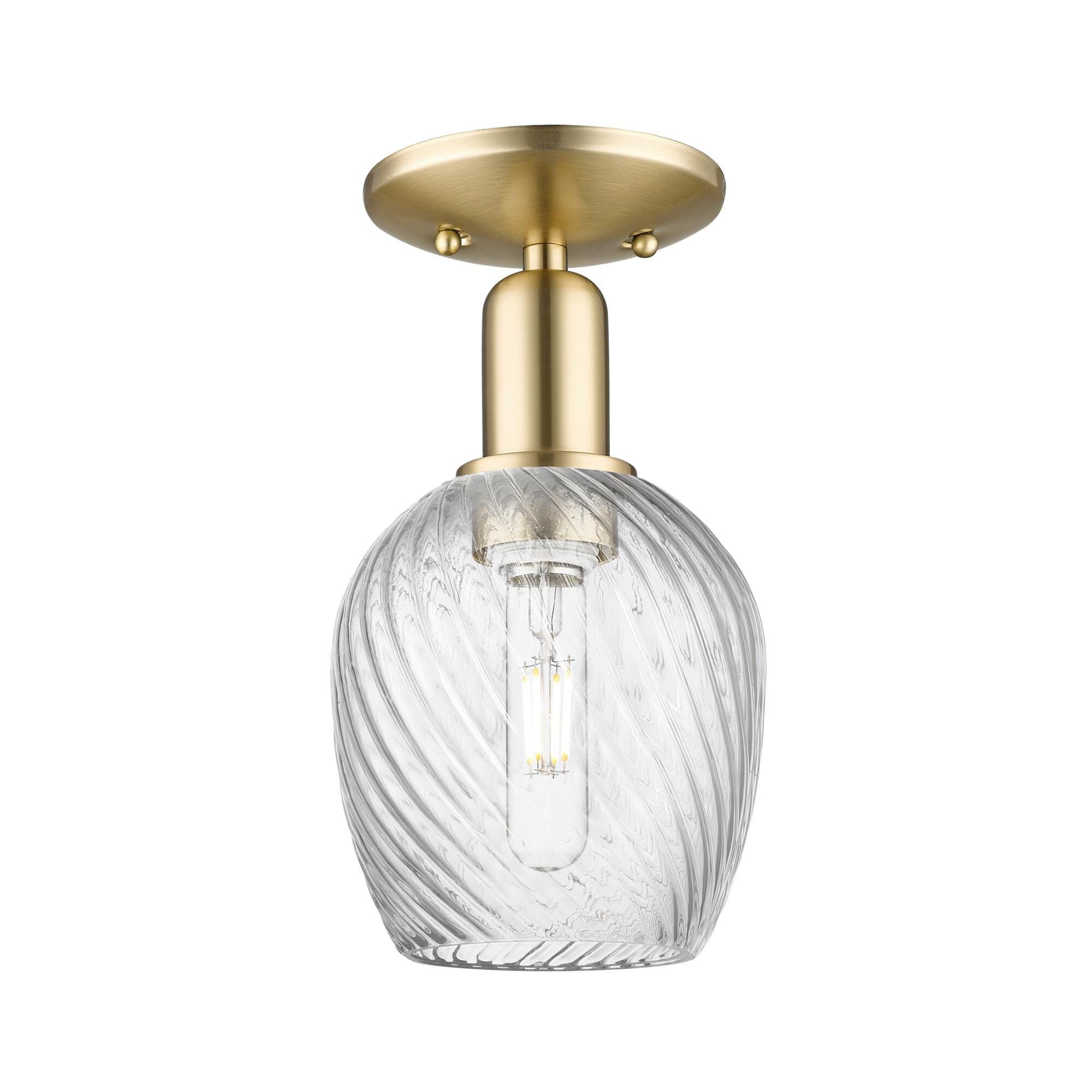 Shown in Champagne Bronze finish and Clear Spiral Fluted glass