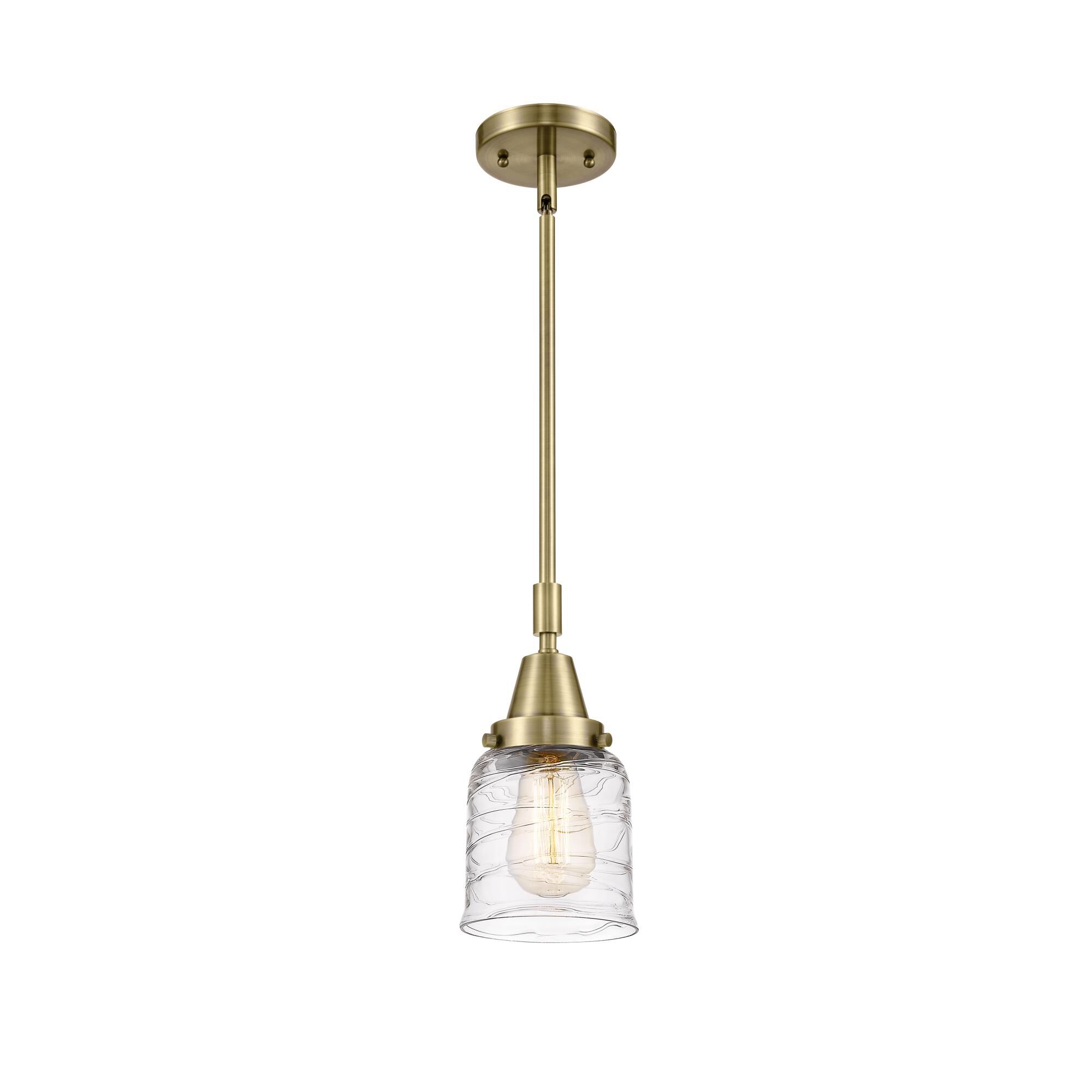Shown in Antique Brass finish and Clear Deco Swirl Small Bell glass