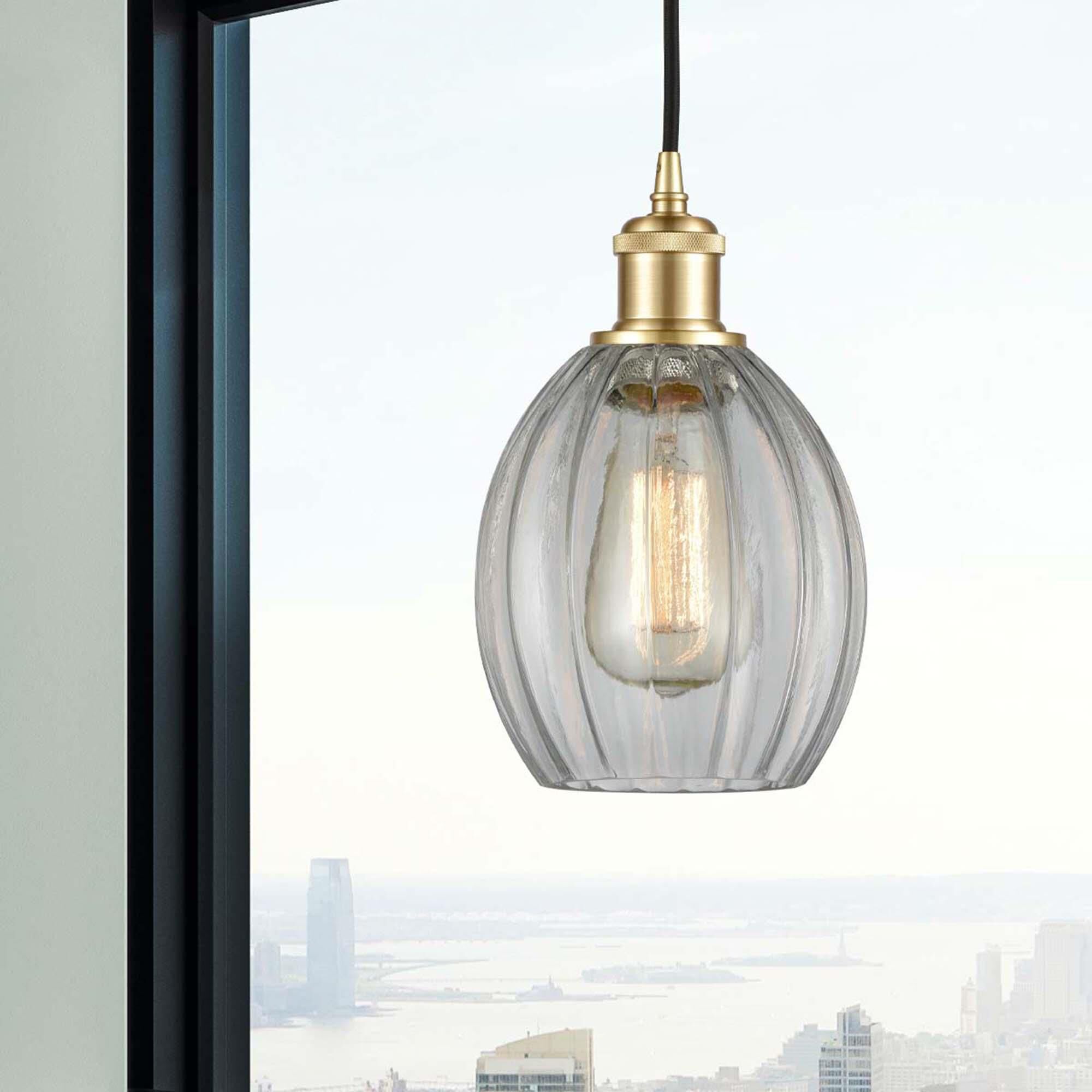 Shown in Satin Gold finish and Clear Eaton glass and Polished Chrome accent