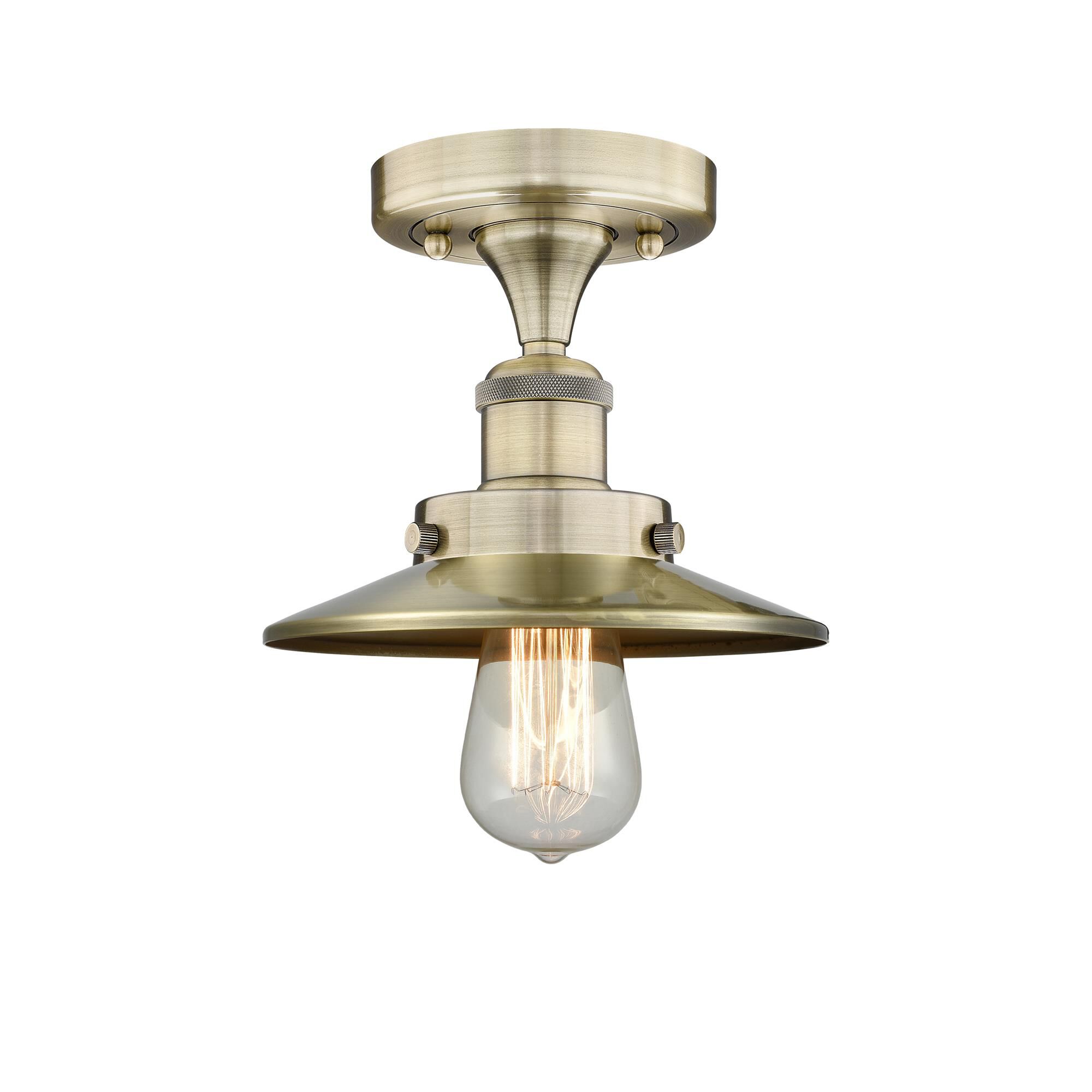 Shown in Antique Brass finish and Antique Brass shade