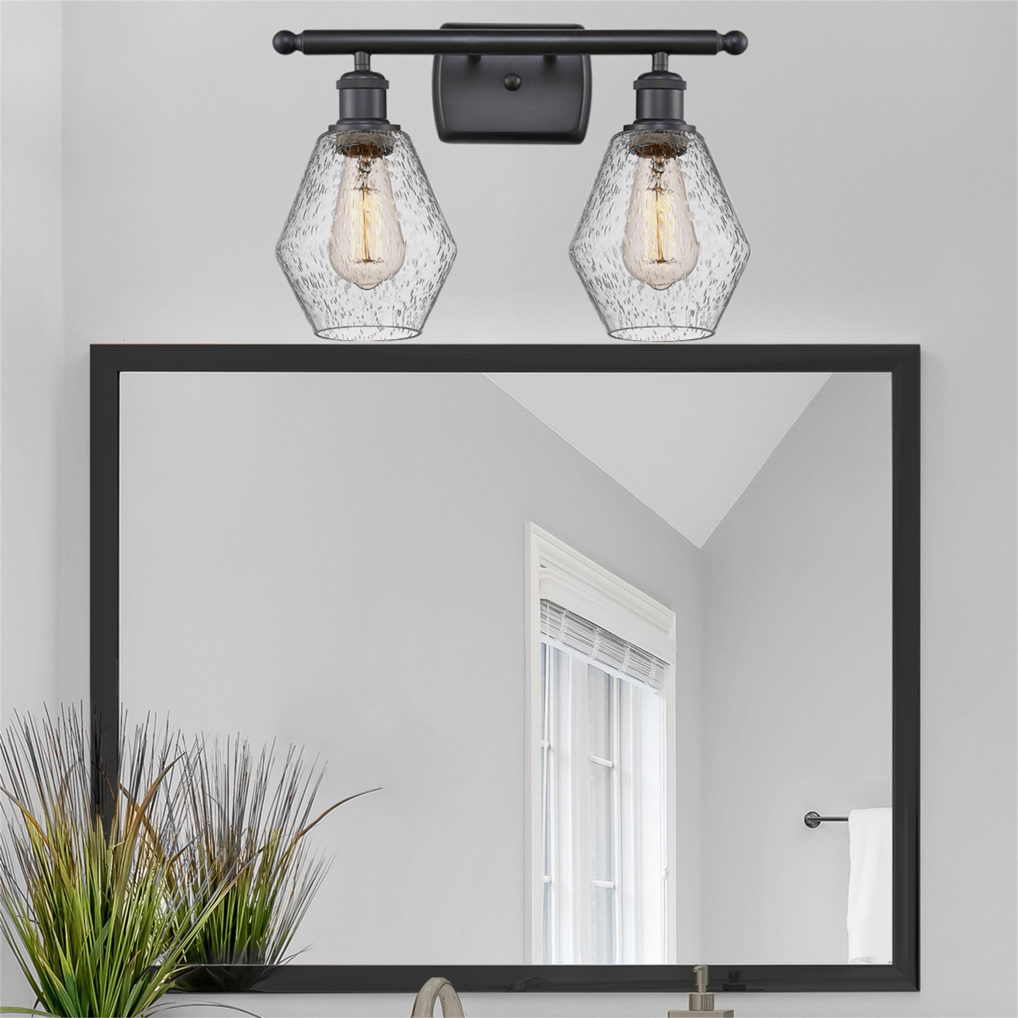 Shown in Matte Black  finish and Seedy glass
