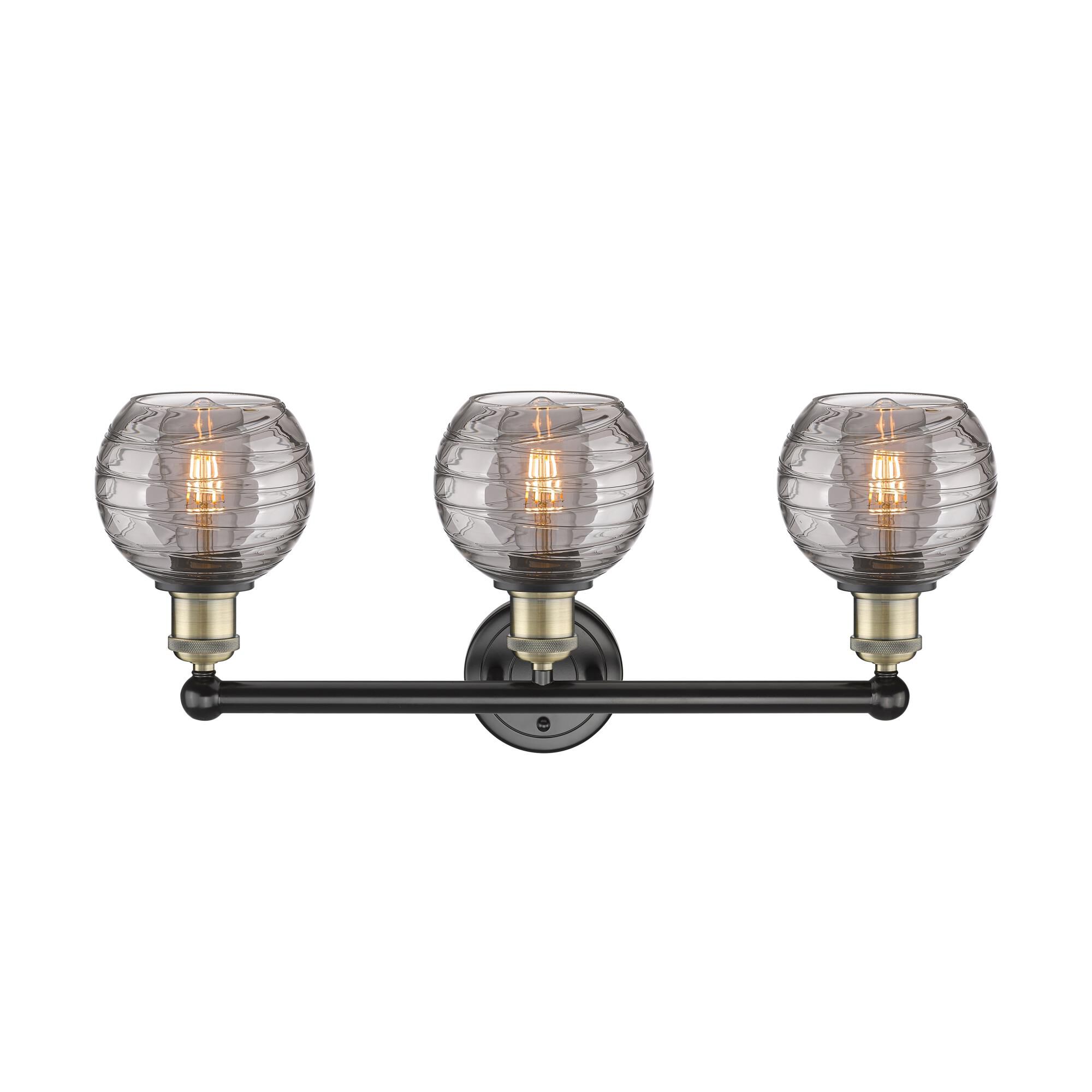Shown in Black Antique Brass finish and Light Smoke Deco Swirl glass
