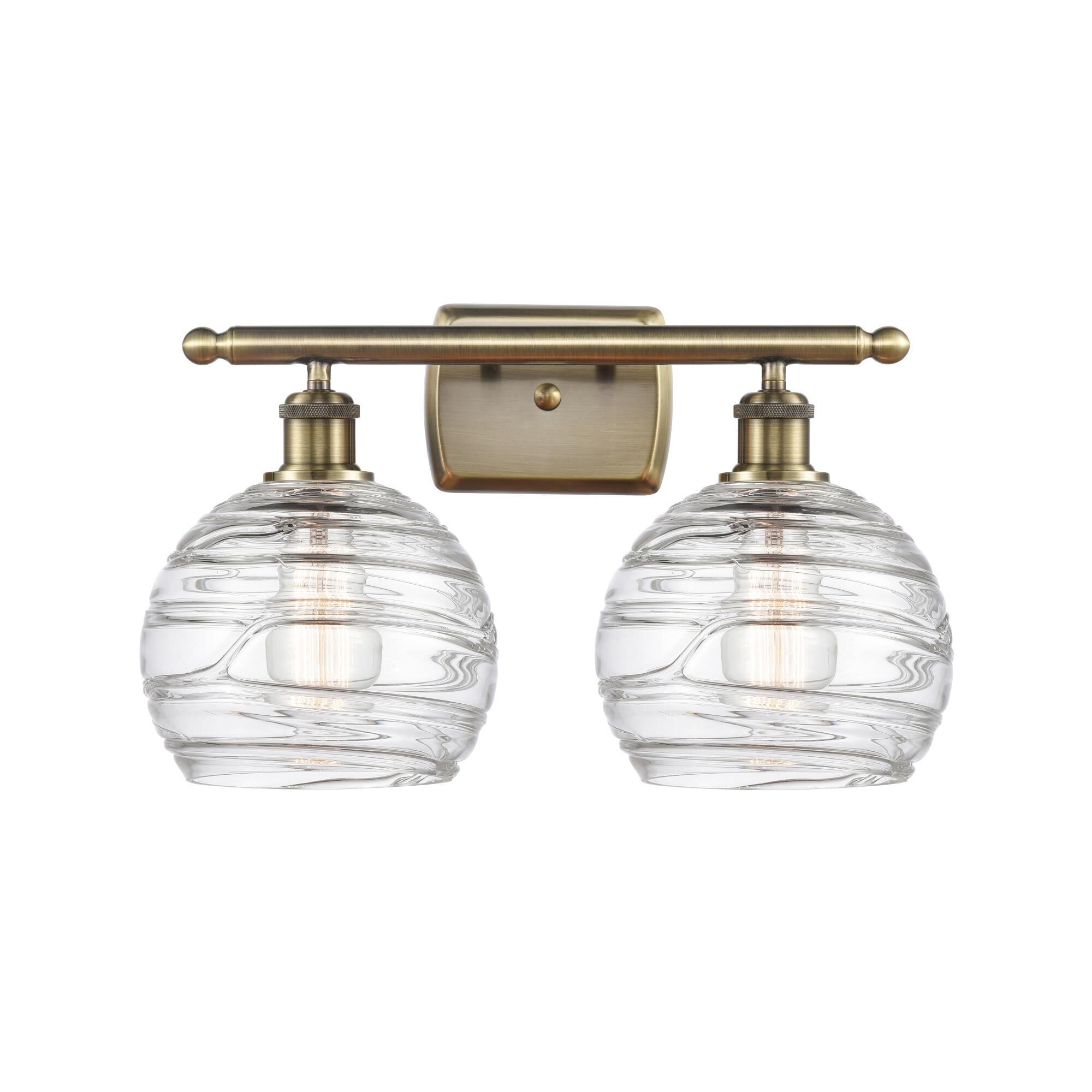 Shown in Antique Brass finish and Sphere glass and Glass shade