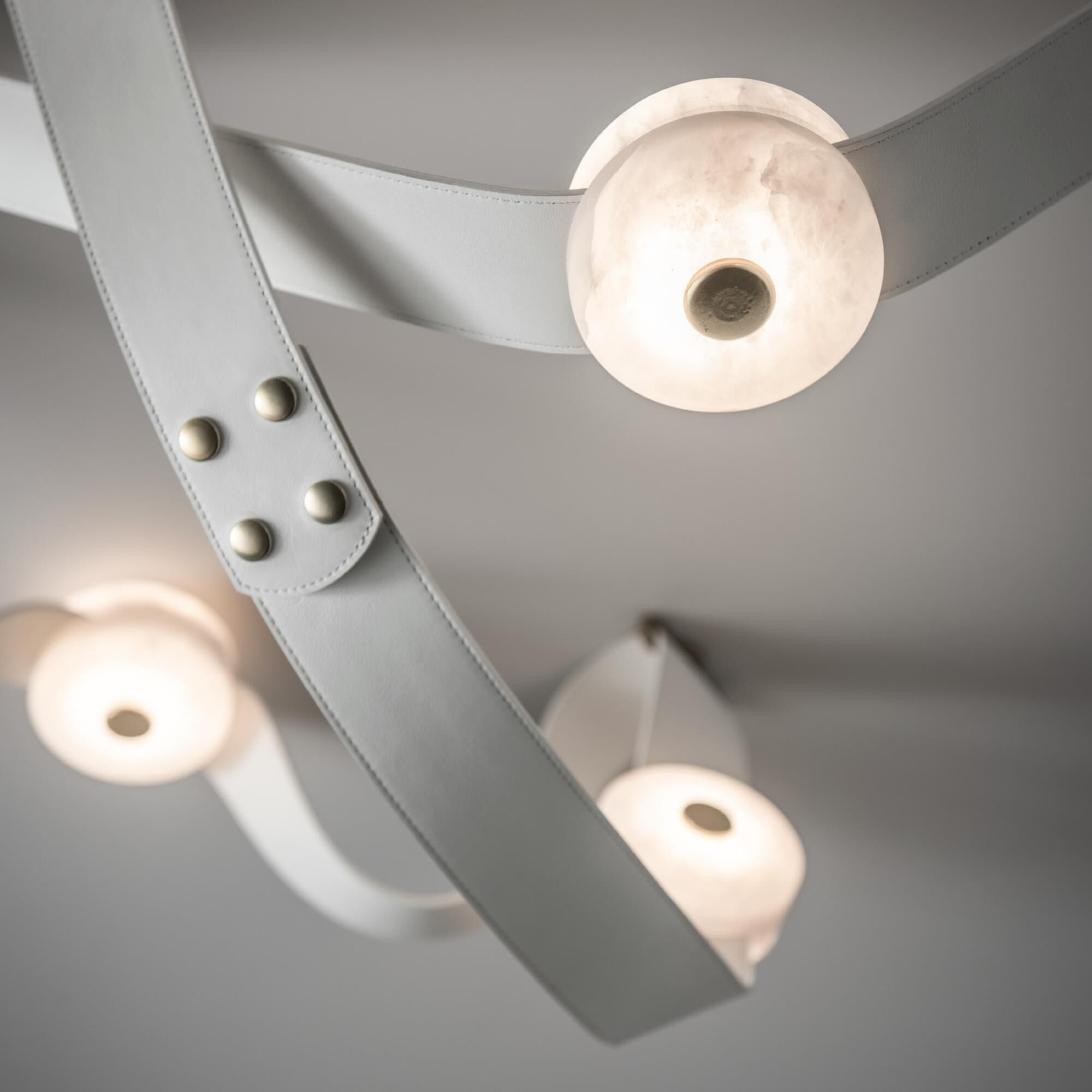 Shown in Modern Brass finish and White Leather accent