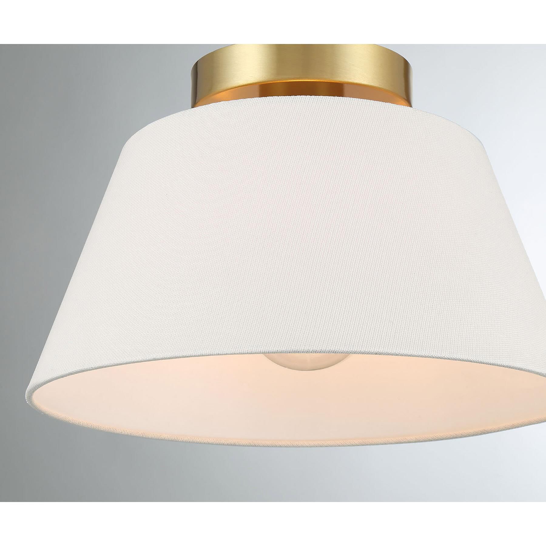 Shown in Natural Brass finish and White Linen Fabric shade