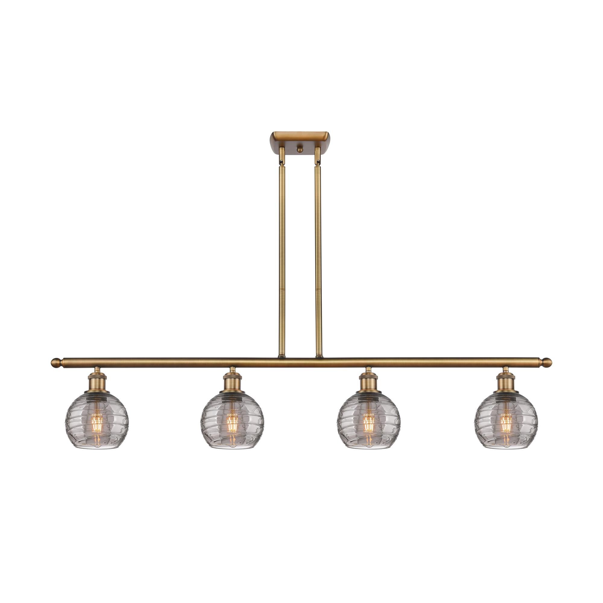 Shown in Brushed Brass finish and Light Smoke Deco Swirl glass