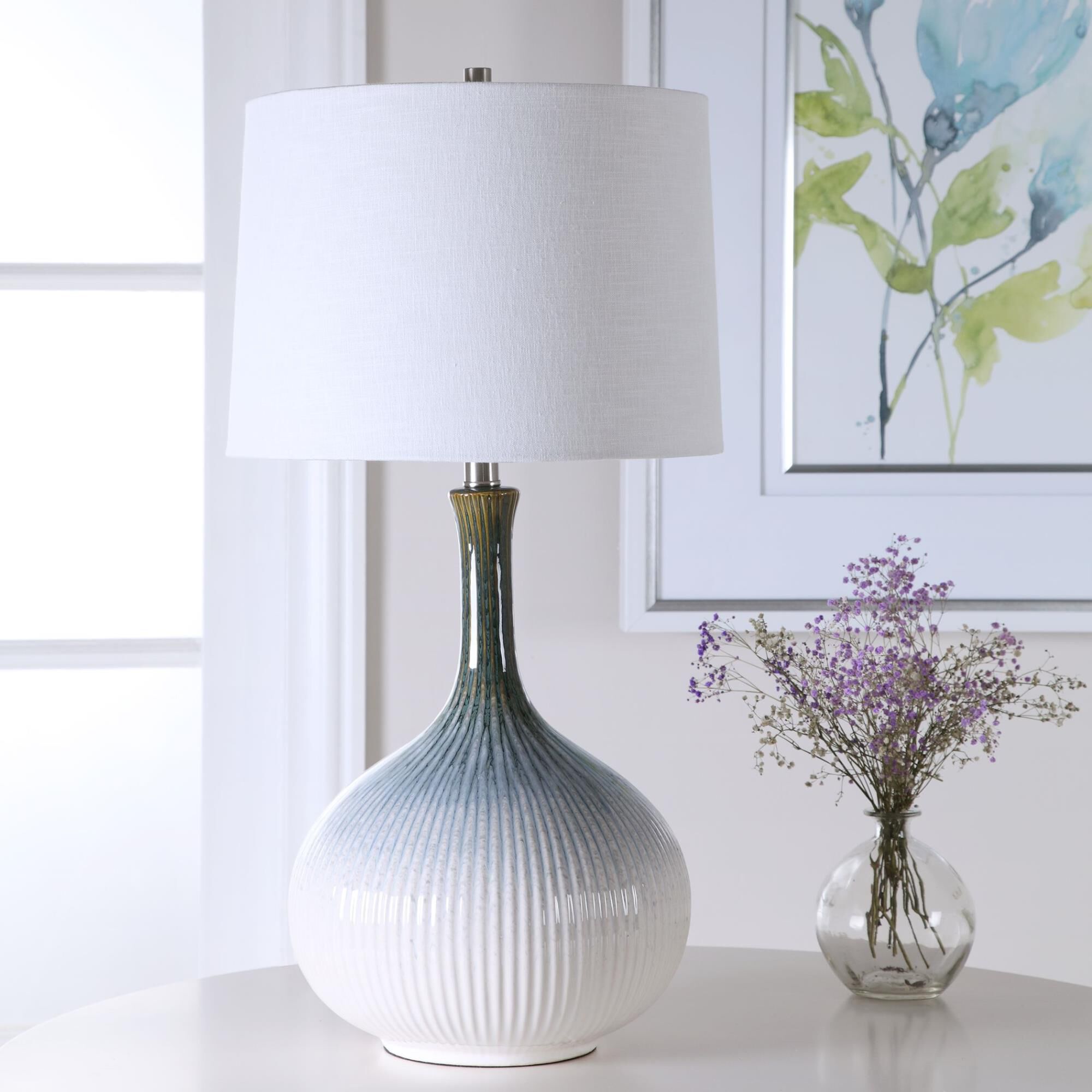 Shown in Mid-Century Inspired Table Lamp Has A Fluted Ceramic Base With Noticeable Ribbed Texture And Is Fini finish and Round Hardback shade
