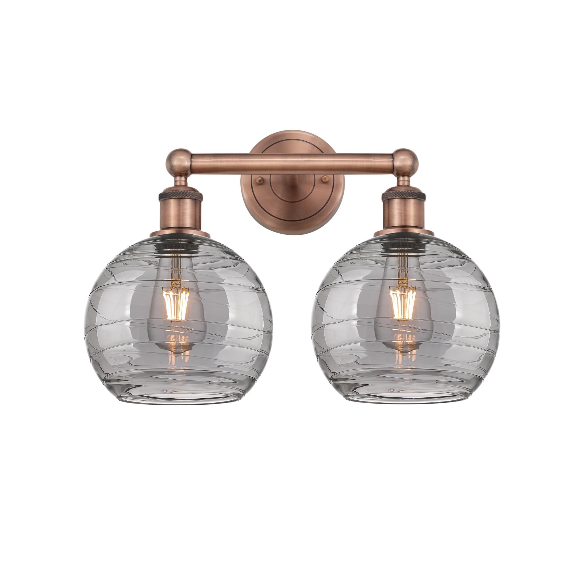 Shown in Antique Copper finish and Light Smoke Deco Swirl glass