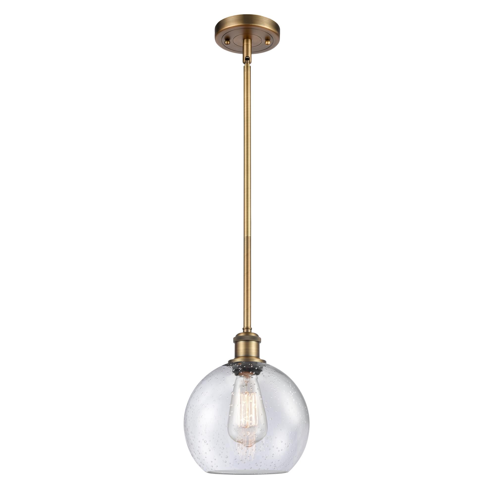 Shown in Brushed Brass finish and Seedy Athens glass