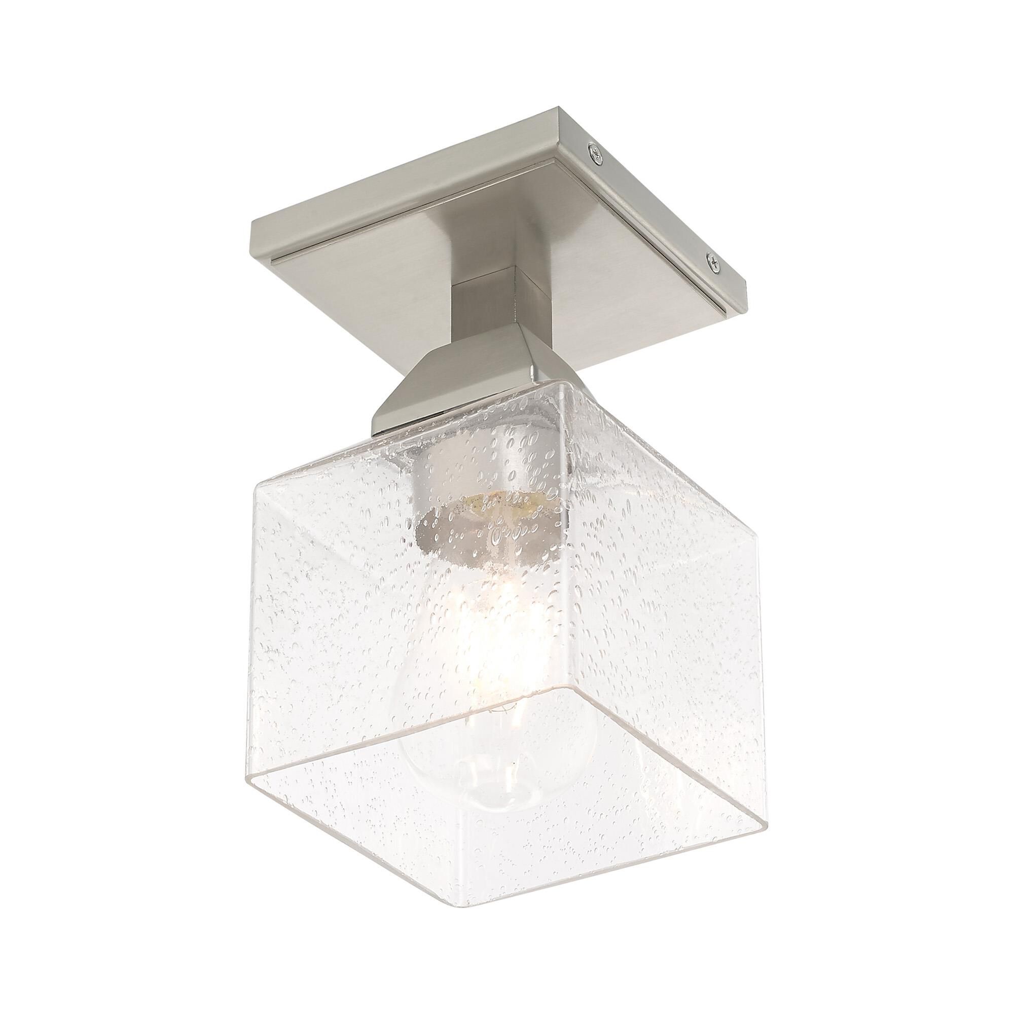 Shown in Brushed Nickel finish and Hand Blown Clear Seeded glass