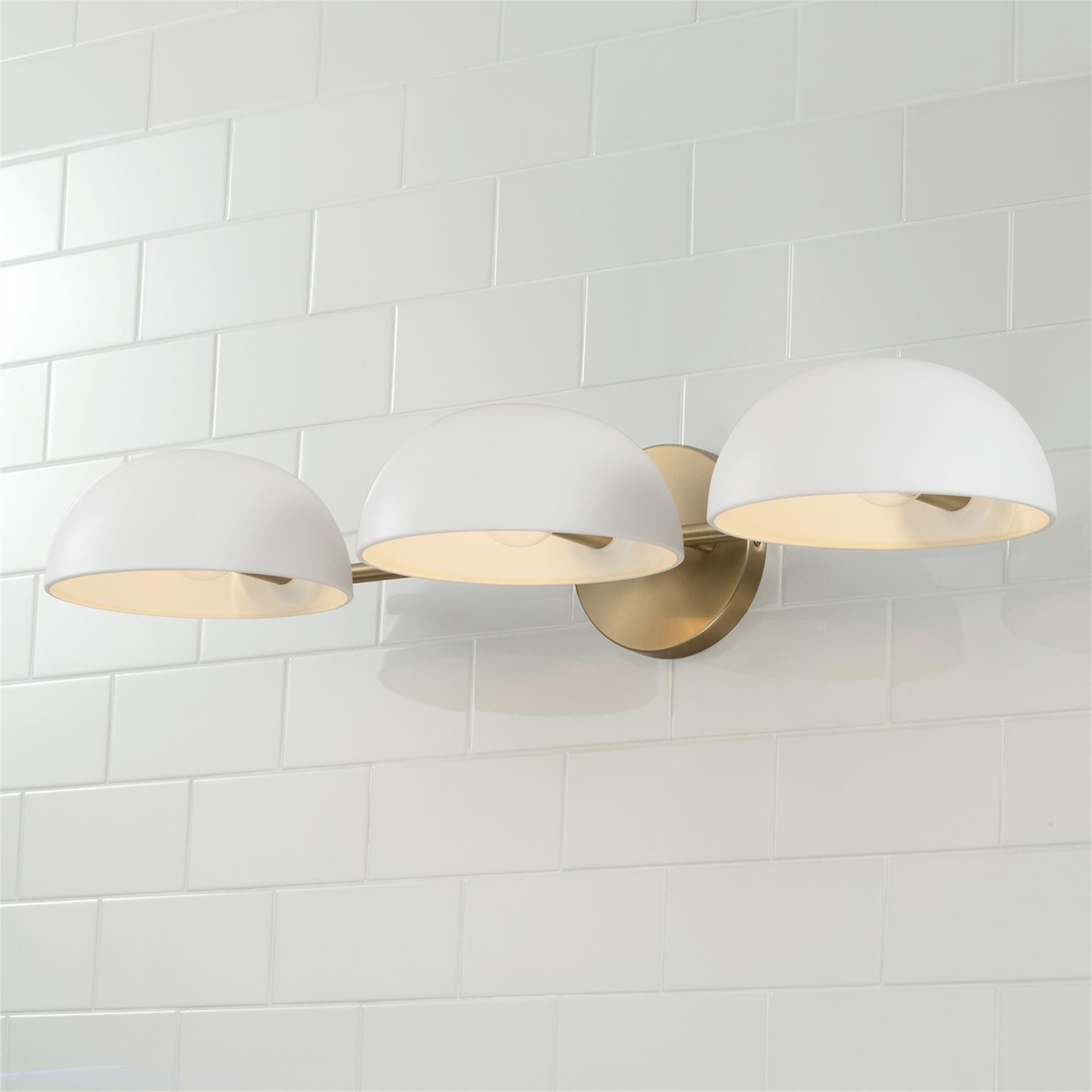 Shown in Aged Brass And White finish and Matte White Metal s shade