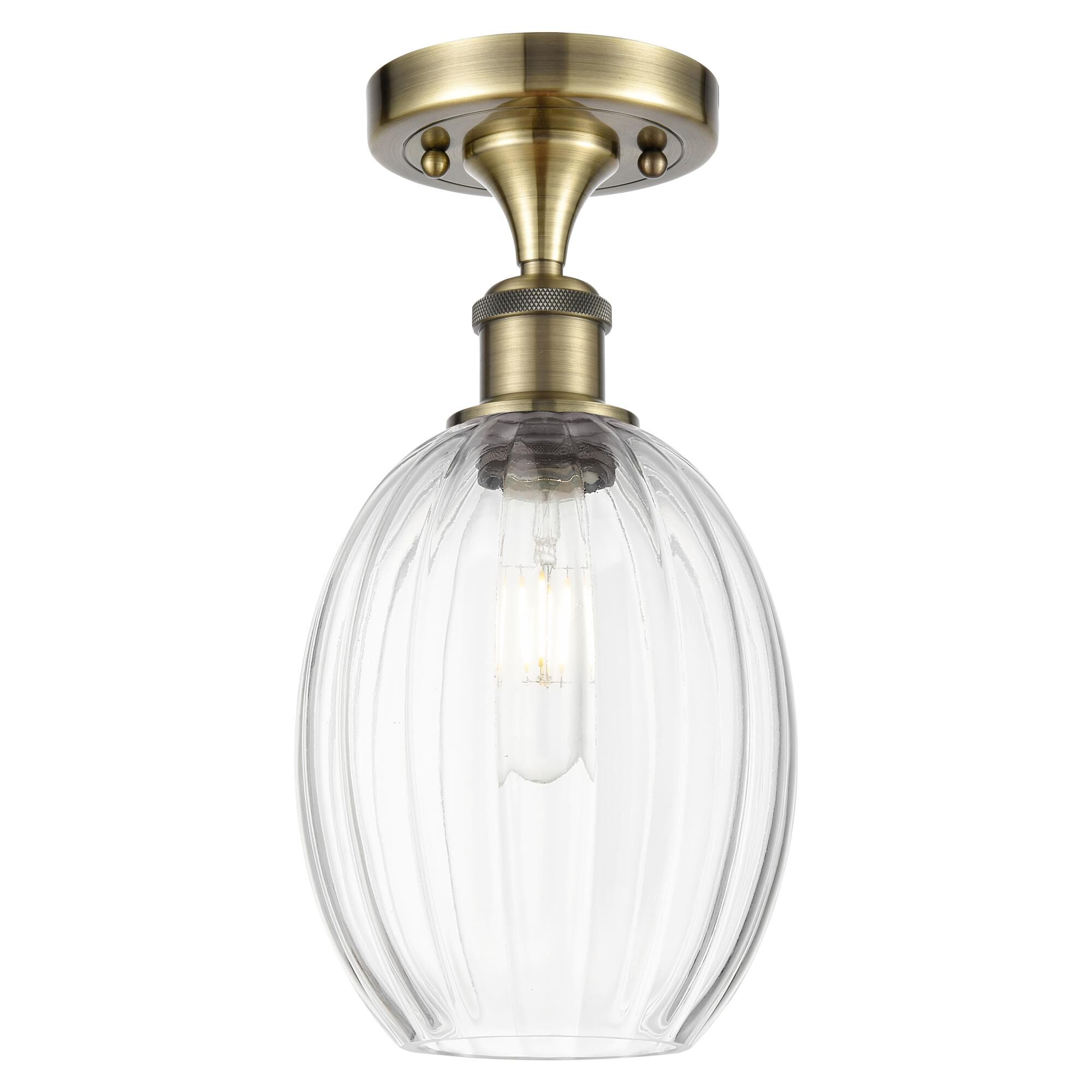 Shown in Antique Brass finish and Clear glass