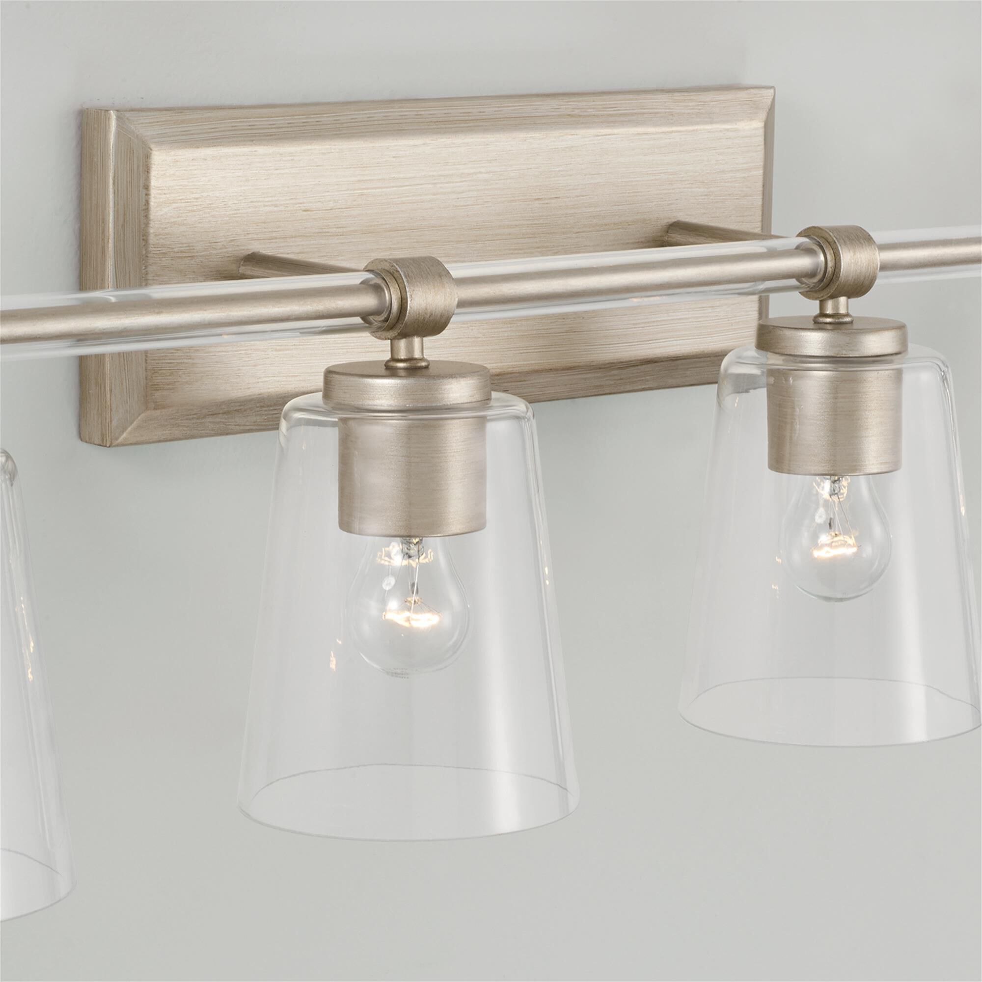 Shown in Brushed Champagne finish and Clear glass