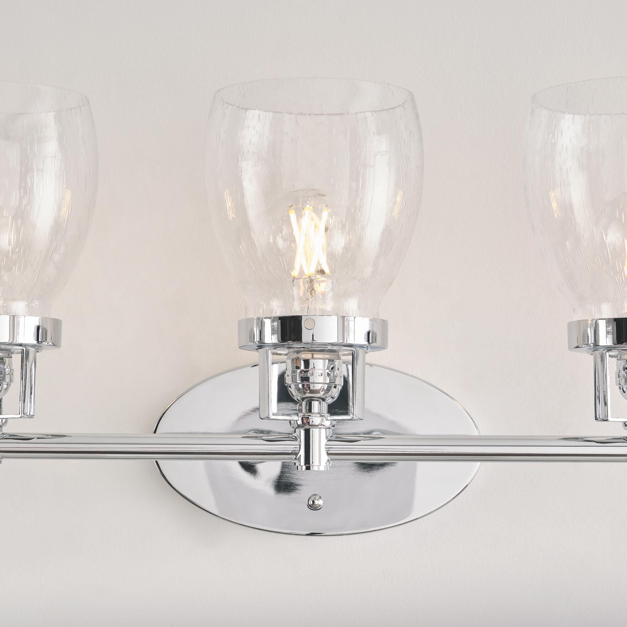 Shown in Chrome finish and Clear Seeded glass