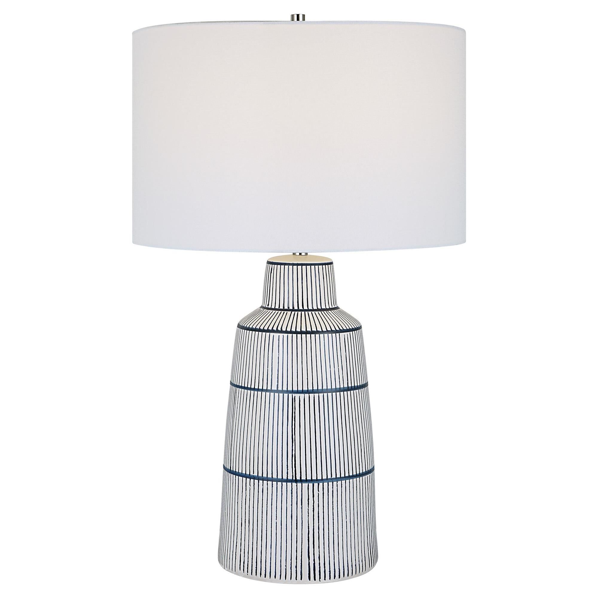 Shown in Inspired By The Classic Nautical Stripe Knit, This Ceramic Table Lamp Sports A Satin White Glaze Wit finish and Round Hardback Drum shade