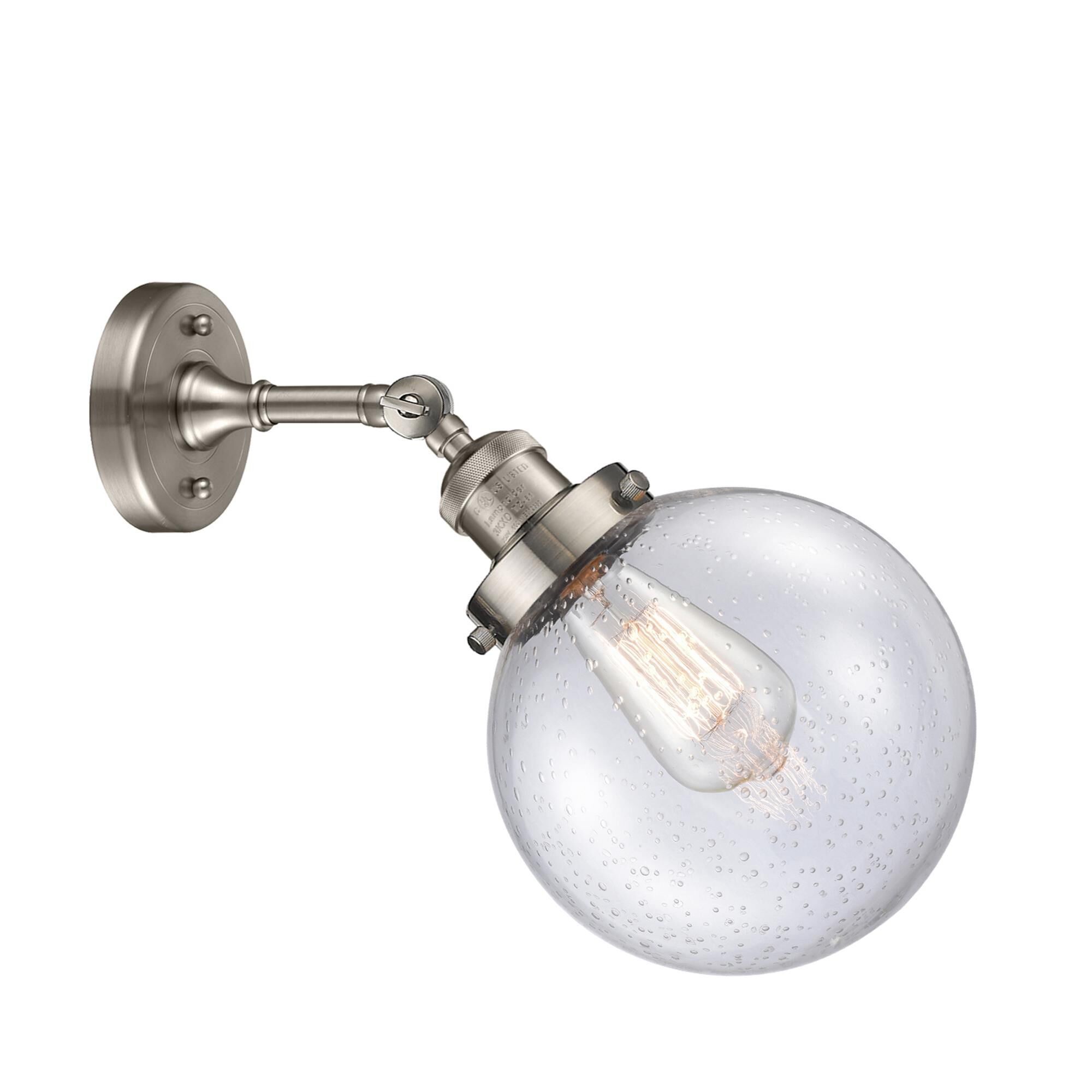 Shown in Brushed Satin Nickel finish and Seedy glass and No Accent accent