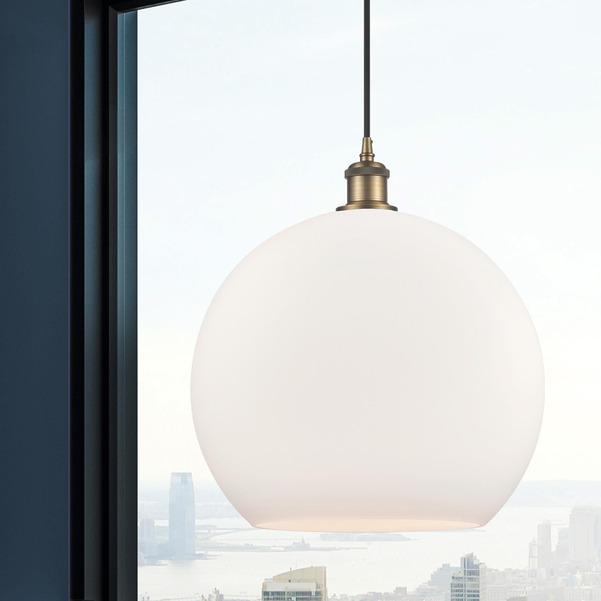 Shown in Brushed Brass finish and Cased Matte White glass