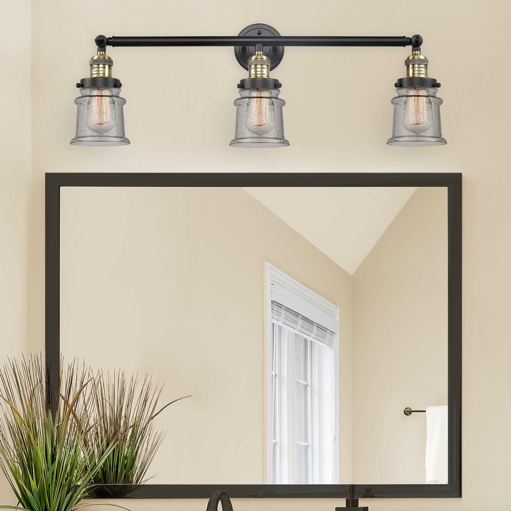 Shown in Black Antique Brass finish and Seedy glass