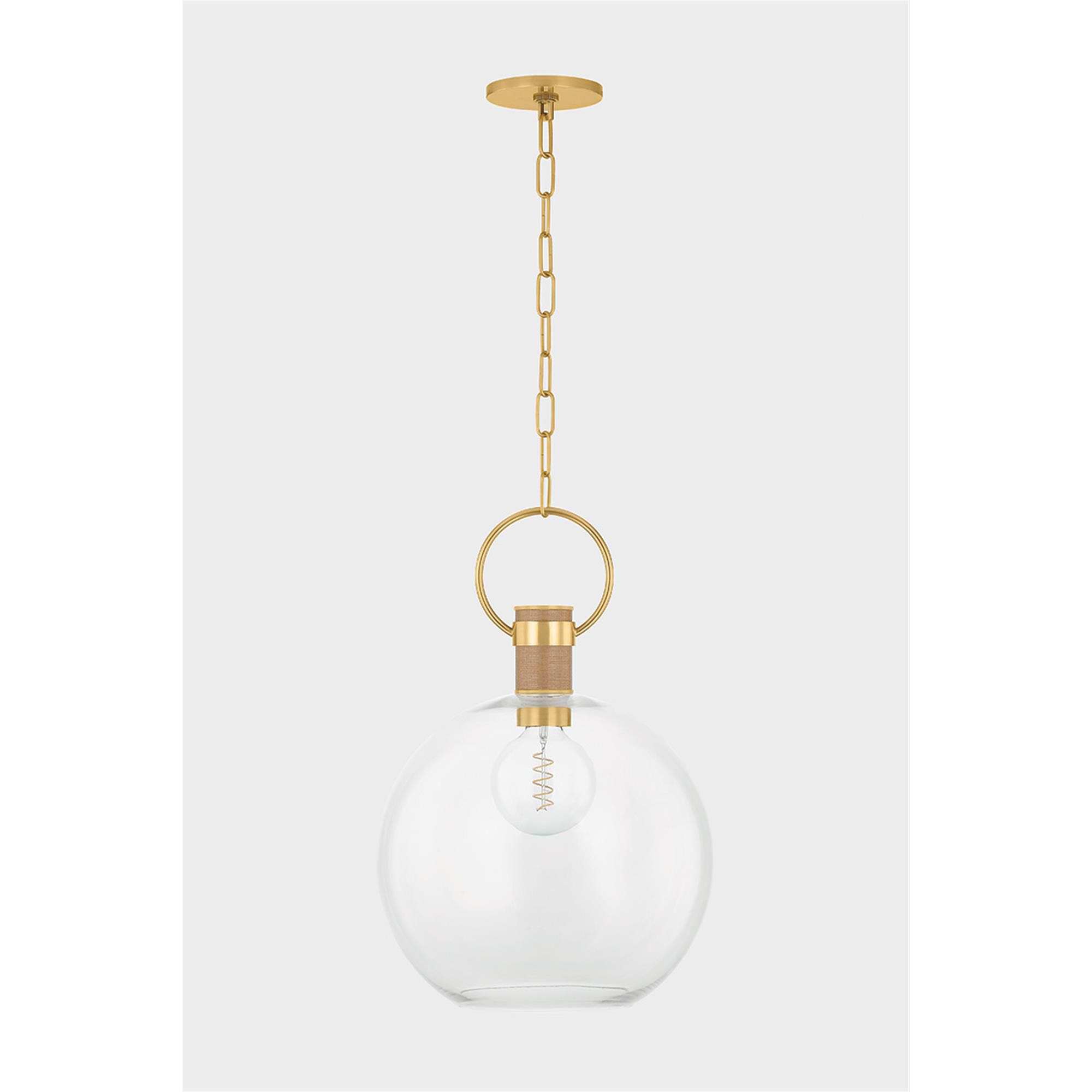Shown in Aged Brass finish and Clear shade