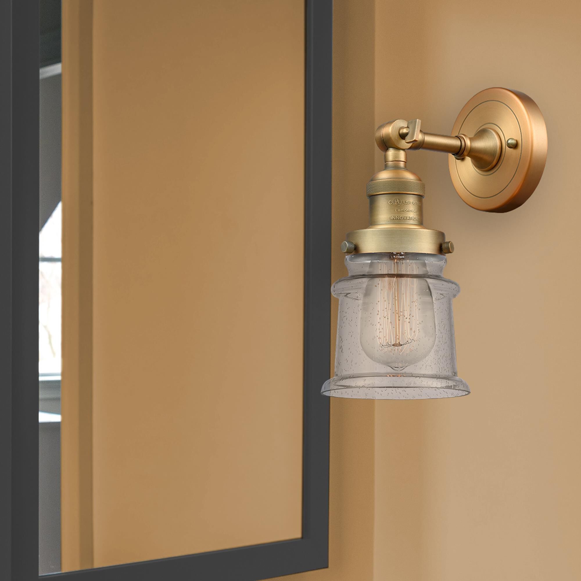 Shown in Brushed Brass finish and Seedy glass